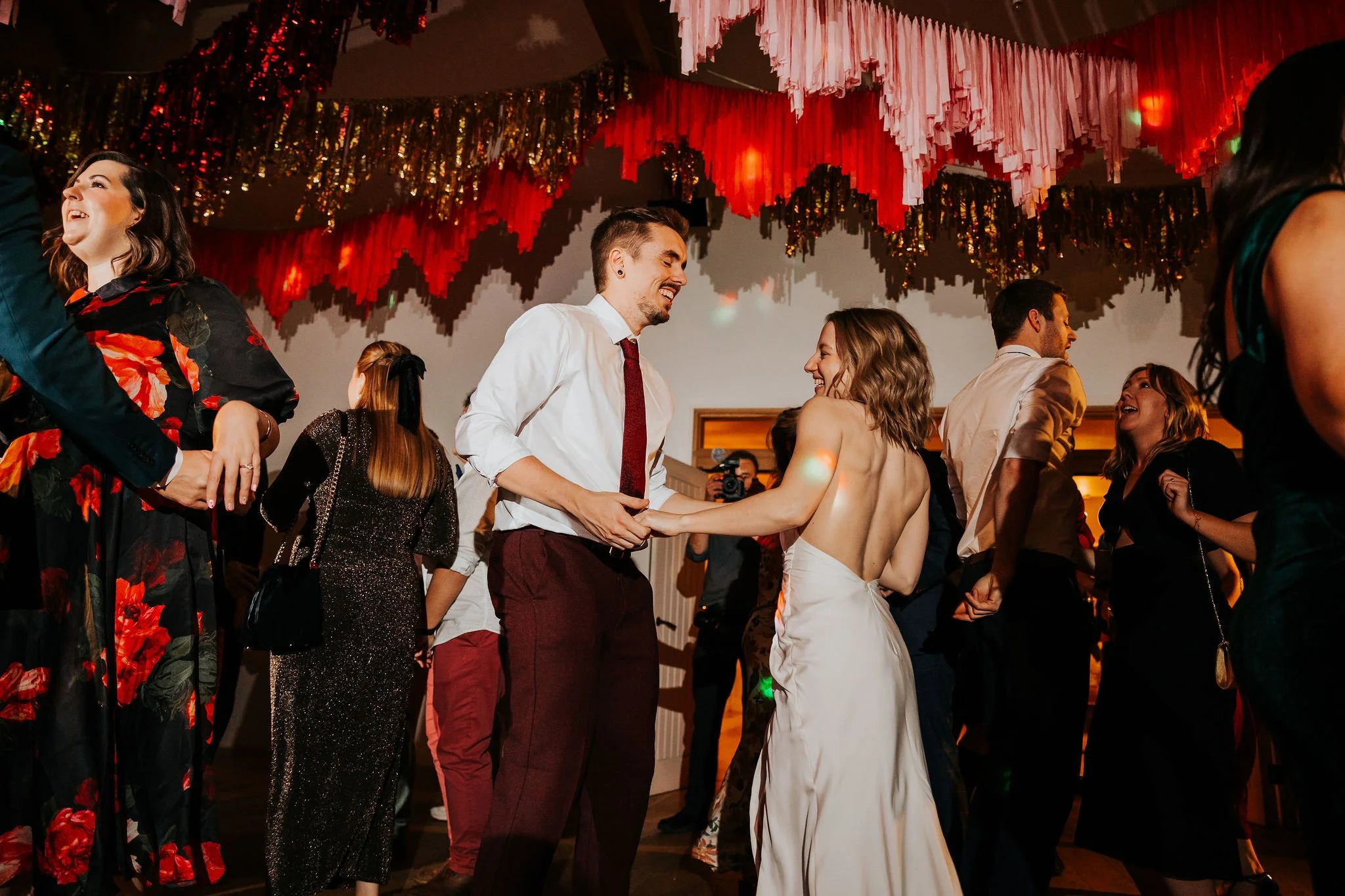 couple dancing under streamers