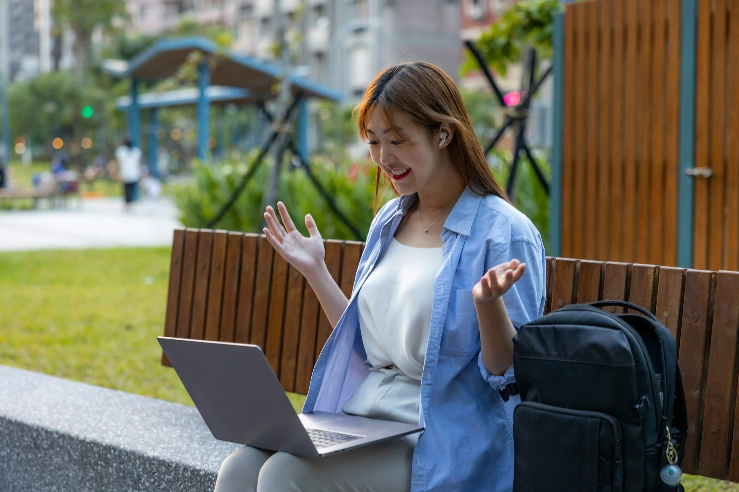 woman on laptop sitting on bench - uplifted avenue