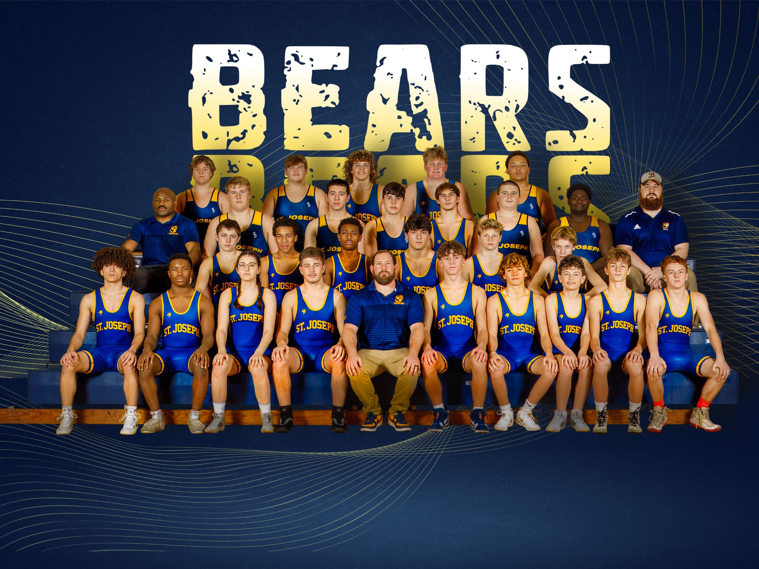 A group photo of a youth basketball team named St. Joseph, wearing blue and yellow uniforms, with coaches, posing on steps in front of a backdrop that reads 'BEARS'.