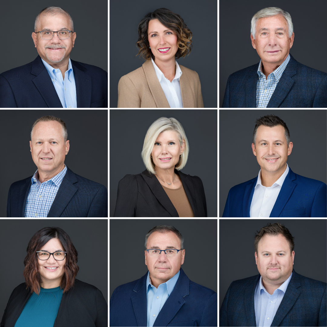 Grand Rapids corporate headshot against grey backdrop team members