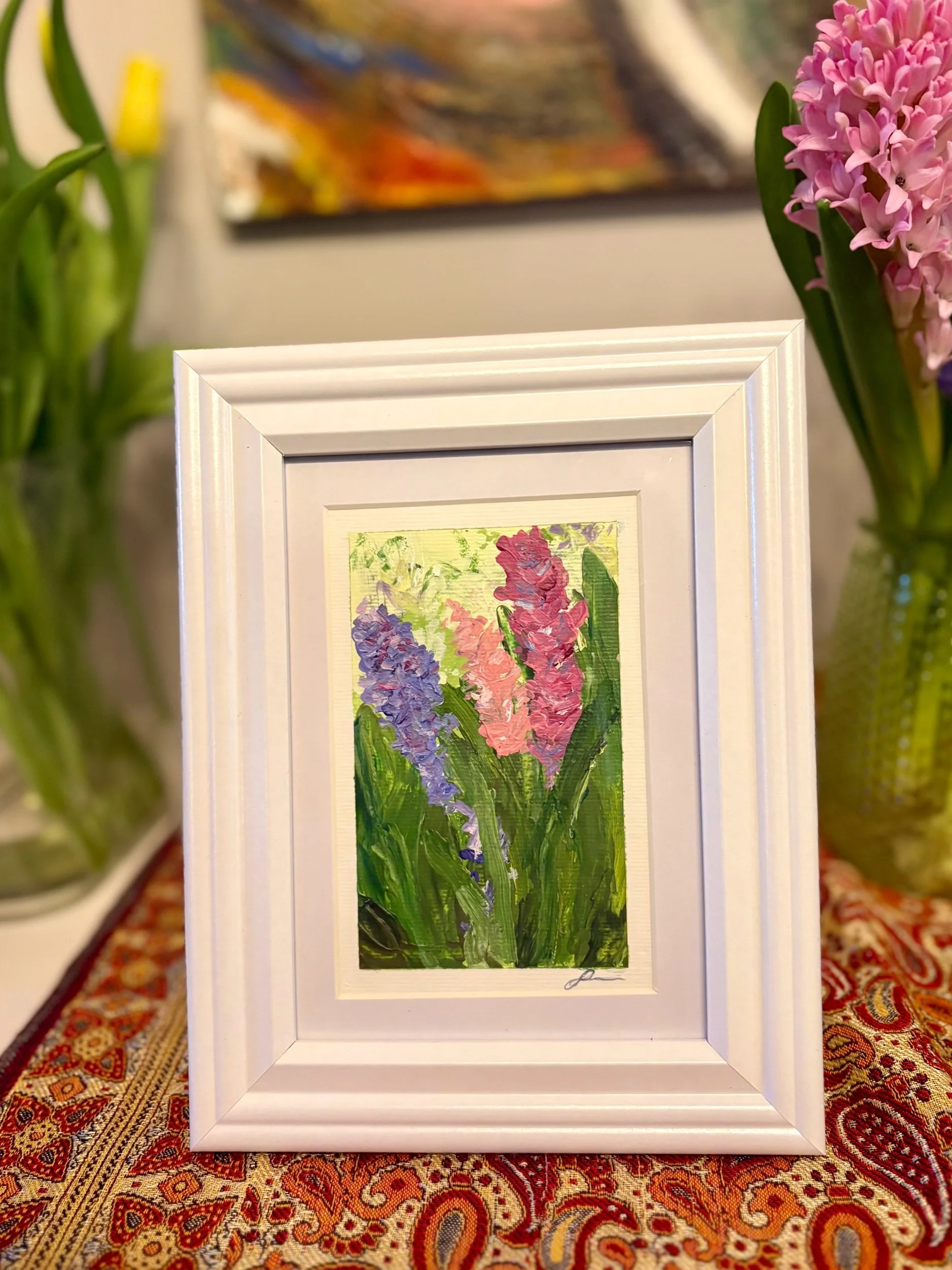 original abstract acrylic painting of hyacinths on paper by artist Sahar Boussard, shown in situ