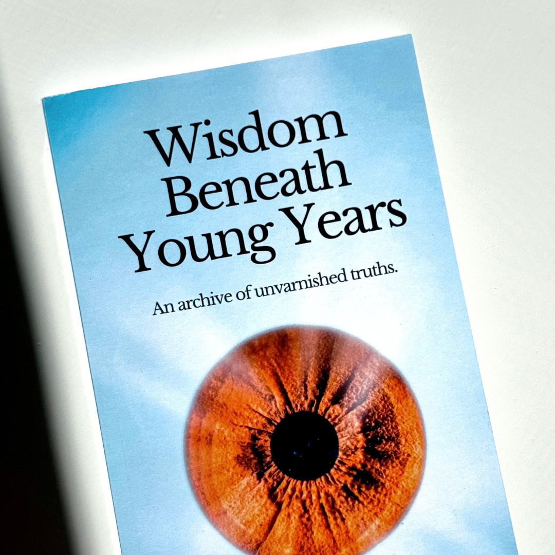 Book titled 'Wisdom Beneath Young Years' with a subtitle 'An archive of unvarnished truths' and an image of a brown eye on the cover.