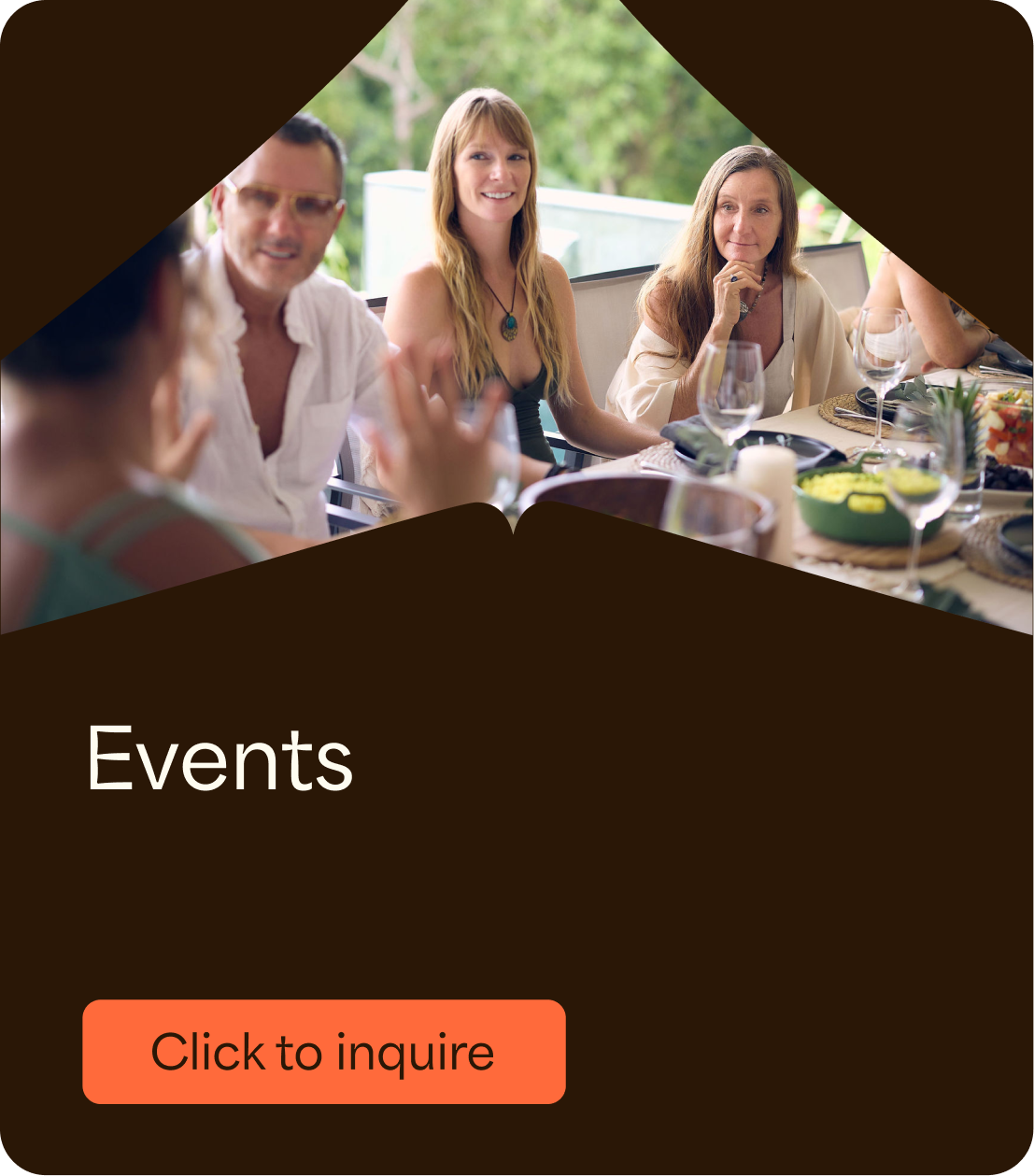 People gathered around a table enjoying a meal outdoors at a social event.
