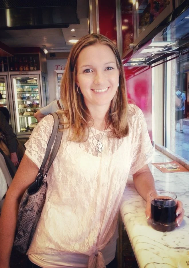 Jennifer in Italy drinking a coke.