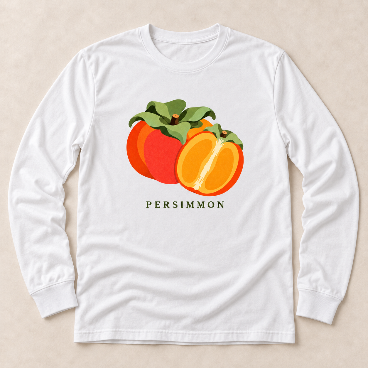 White Persimmon long-sleeve T-shirt with a whole orange persimmon, a cut half and green leaves on the front.