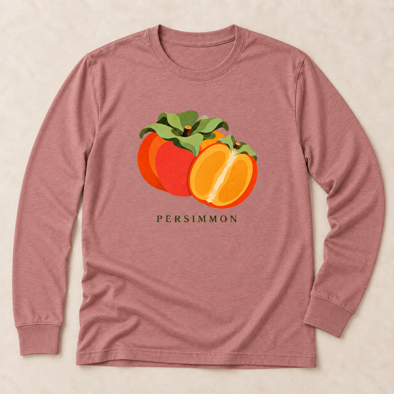 Heather Mauve Persimmon long-sleeve T-shirt with a whole orange persimmon, a cut half and green leaves on the front.