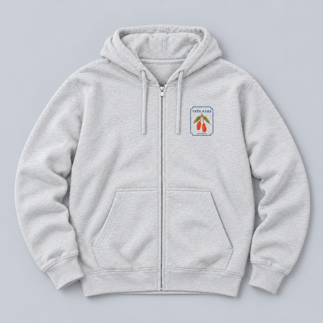 goumi-zip-heather-grey-front-relaxed-flat-lay.png