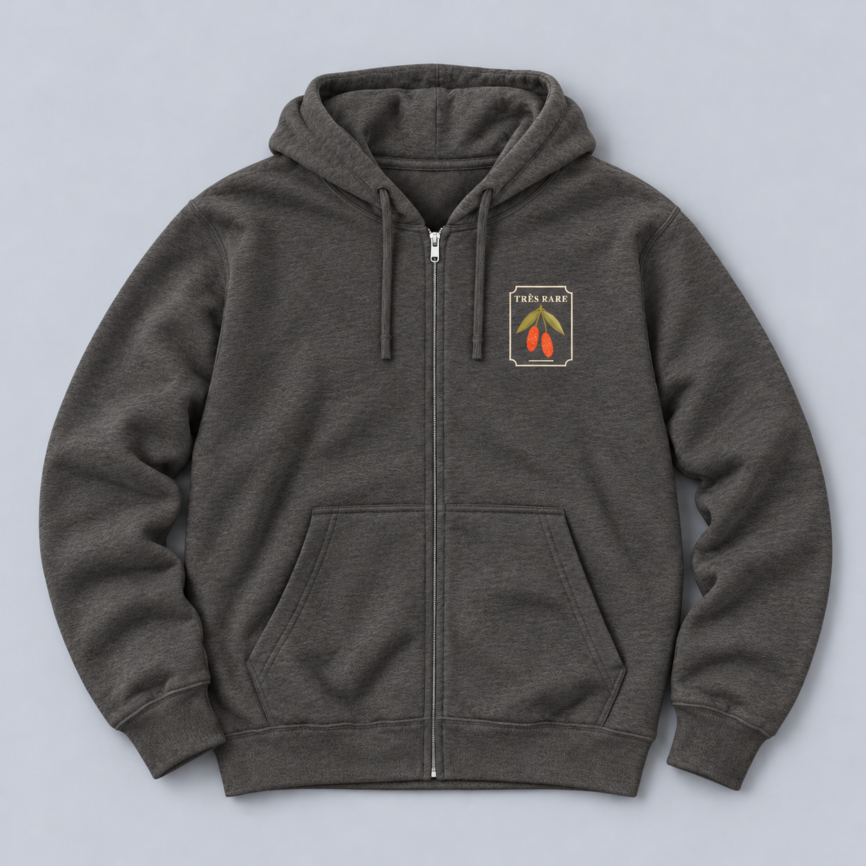 goumi-zip-charcoal-heather-front-relaxed-flat-lay.png