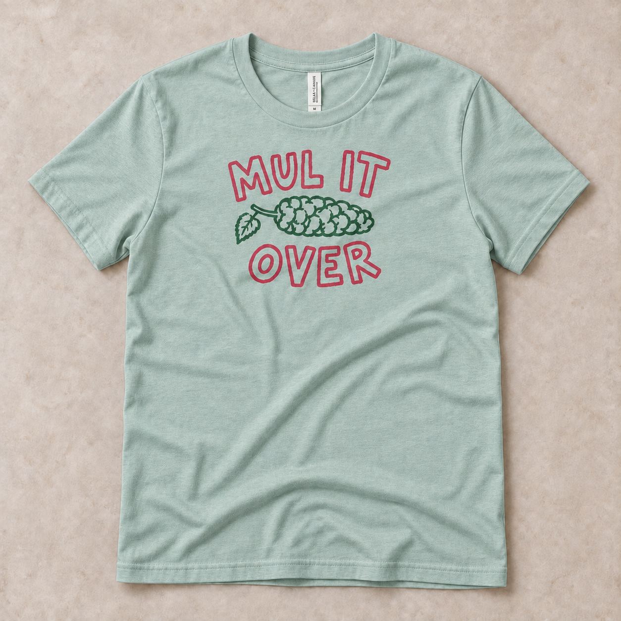 mul-it-over-tshirt-heather-prism-dusty-blue-front-flatlay-v2.png