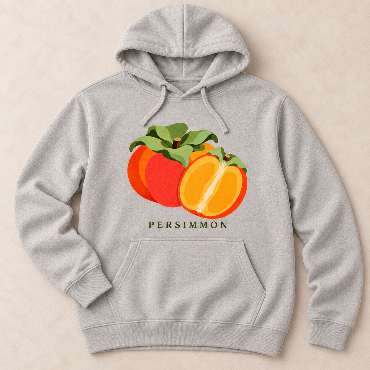 Carbon Grey Persimmon pullover hoodie with a whole orange persimmon, a cut half and green leaves above the front pocket.