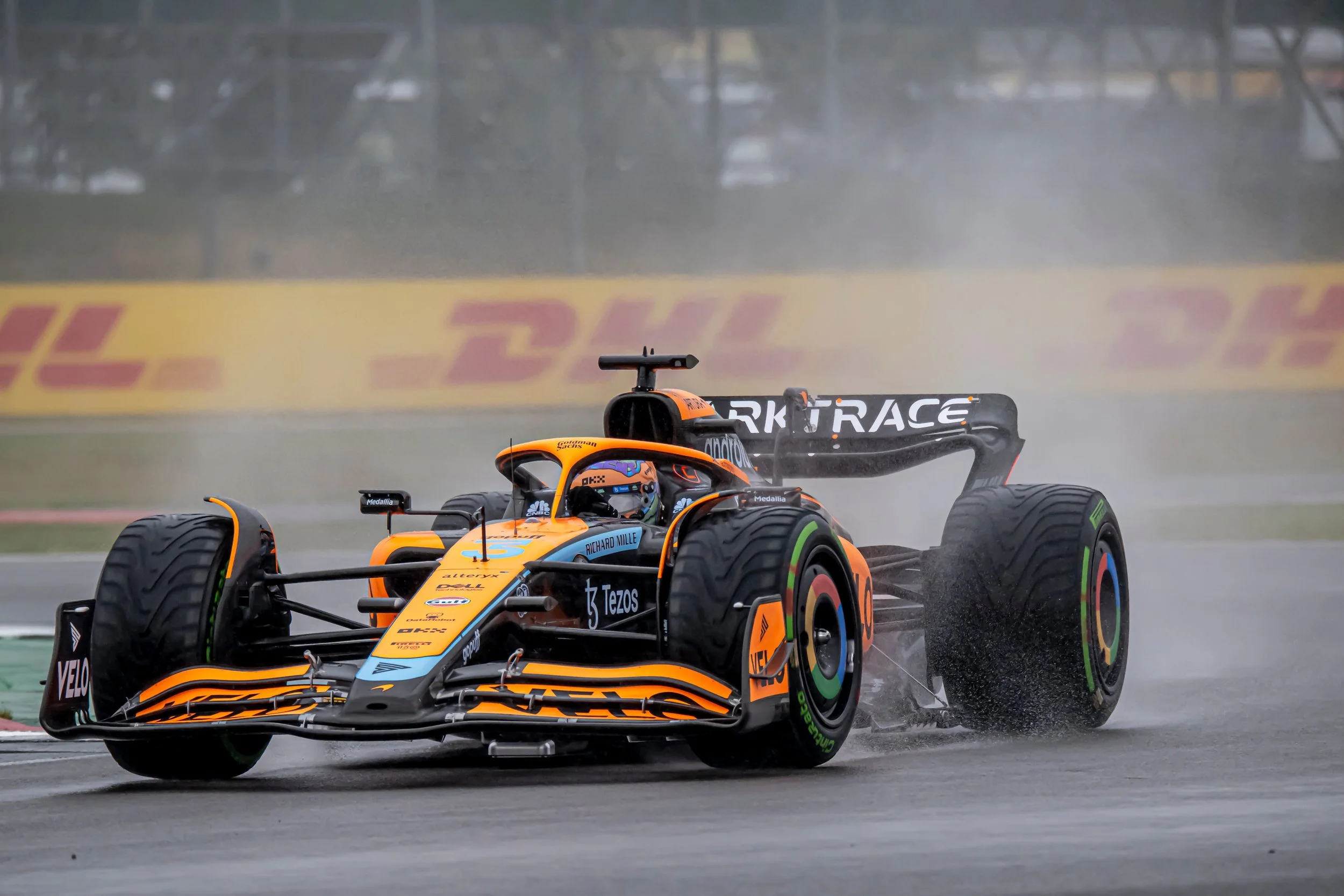 Lando Norris driving in the wet in Silverstone - 2024