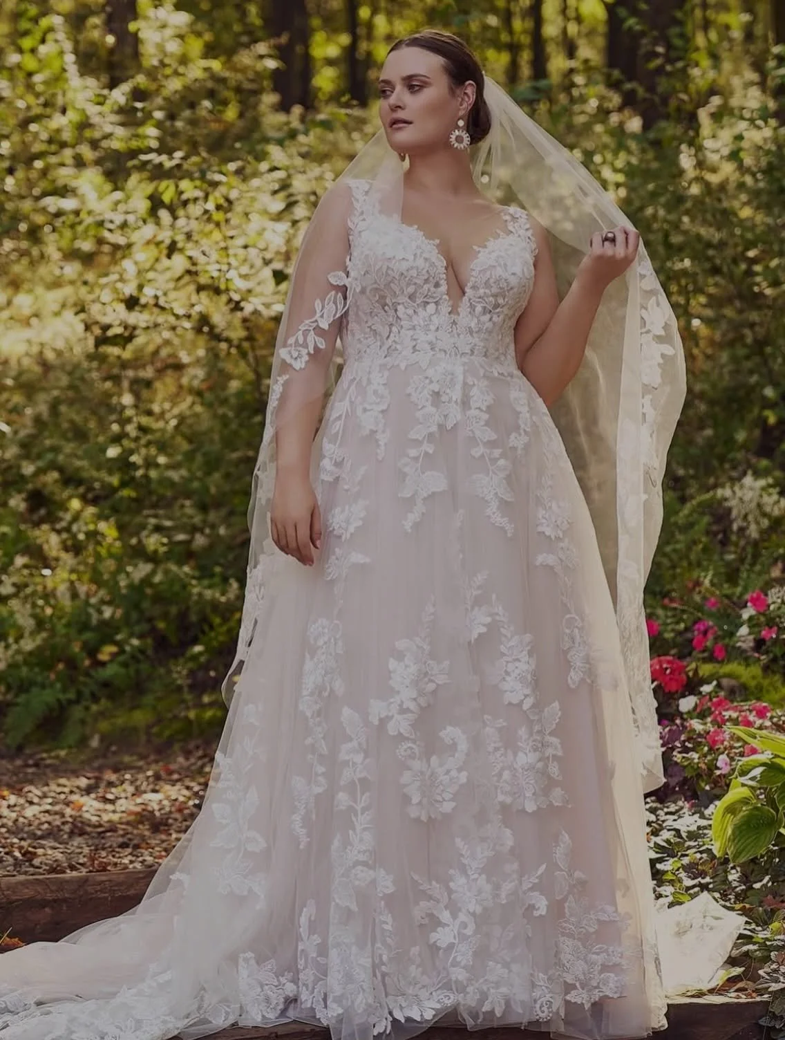 she&rsquo;s baaaccckkkk! our best seller for years, Lillian West style 66163 was retired last year but she is back by popular demand. 

A floaty A-line skirt, embroidered lace that cascades from the bodice into the train, a plunging illusion neckline