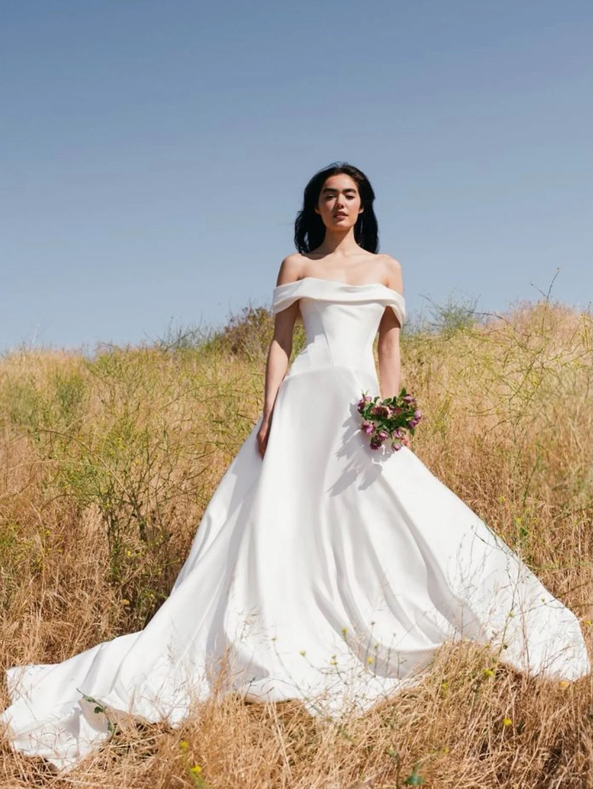 GREER 

this @jennyyoonyc gown is in collaboration with bridal stylist, Hope LaVine, and offers modern details on a timeless style. angled corset seams meet a curved drop waist, all tied in with the soft off the shoulder neckline ✨