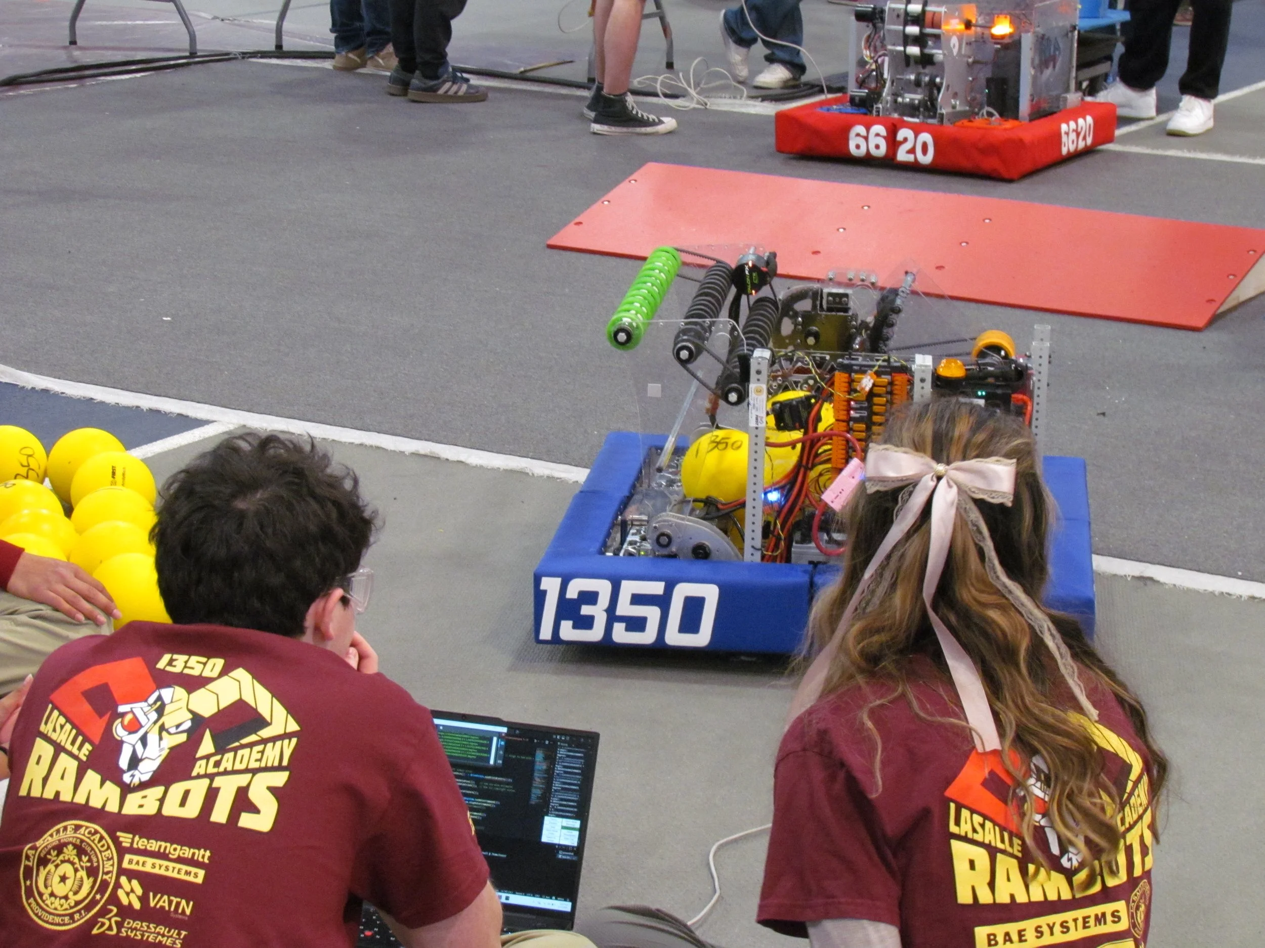 A picture of our code team working on our robot.