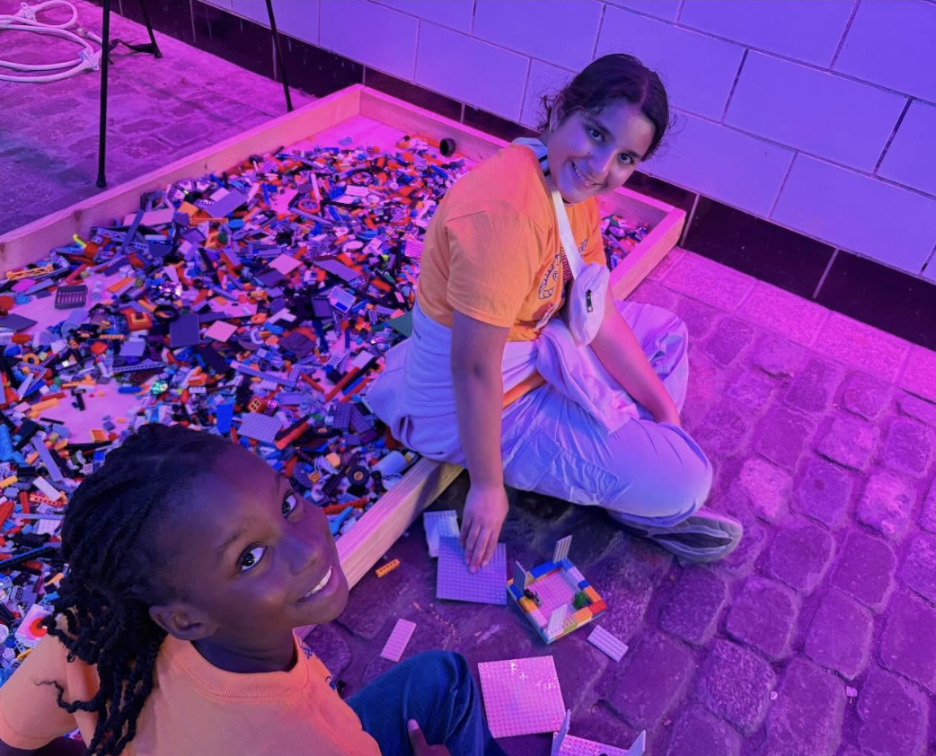 FLL Members using the Lego sandbox.