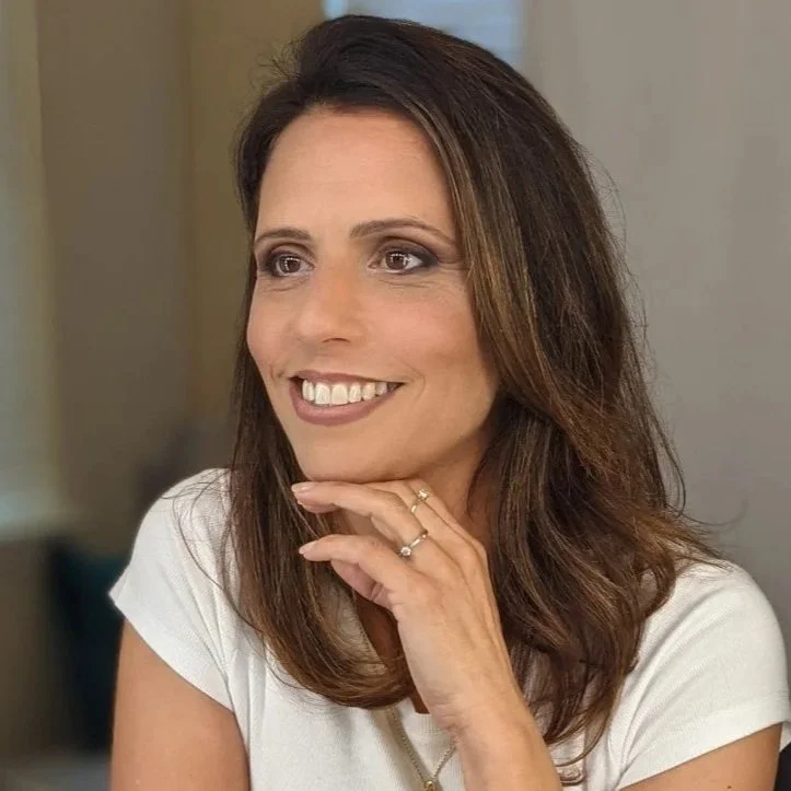 Portrait of Maybar Durst, founder of TeamUp, a corporate events and team-building company, smiling in a professional headshot.