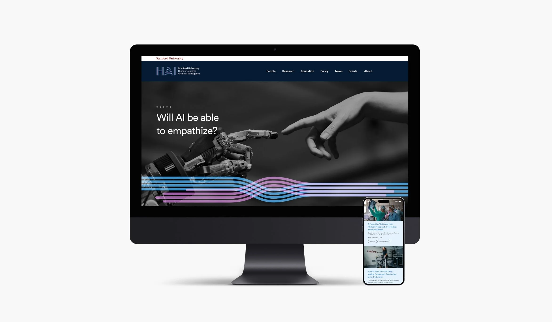 A computer monitor displaying a webpage about AI and robotics, with a robotic hand reaching towards a human hand, and a smartphone showing a related article.
