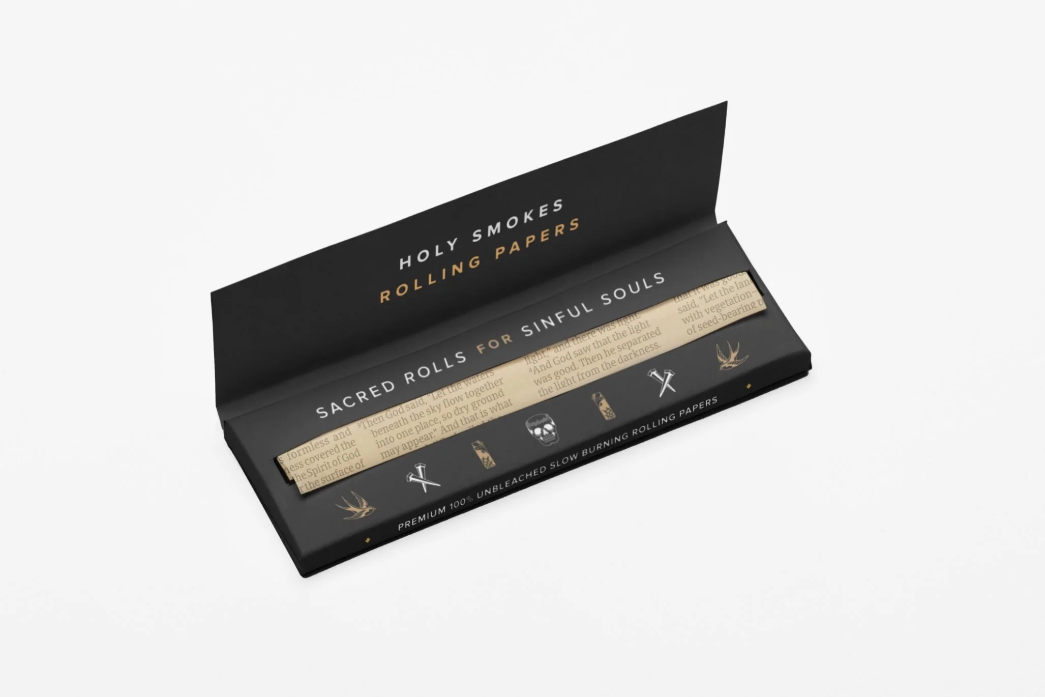 Open black box of Holy Smokes rolling papers with text label, partially revealing beige rolling papers with printed text inside.