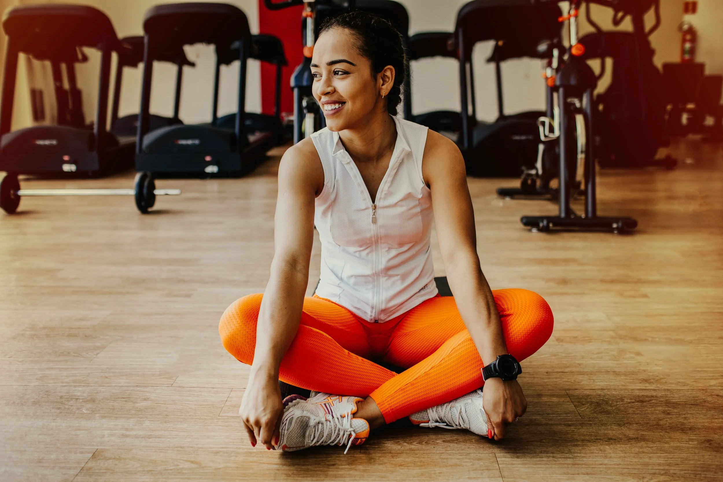 Resident using a fitness center, an example of how building amenities can influence buyer demand and resale value in NYC real estate