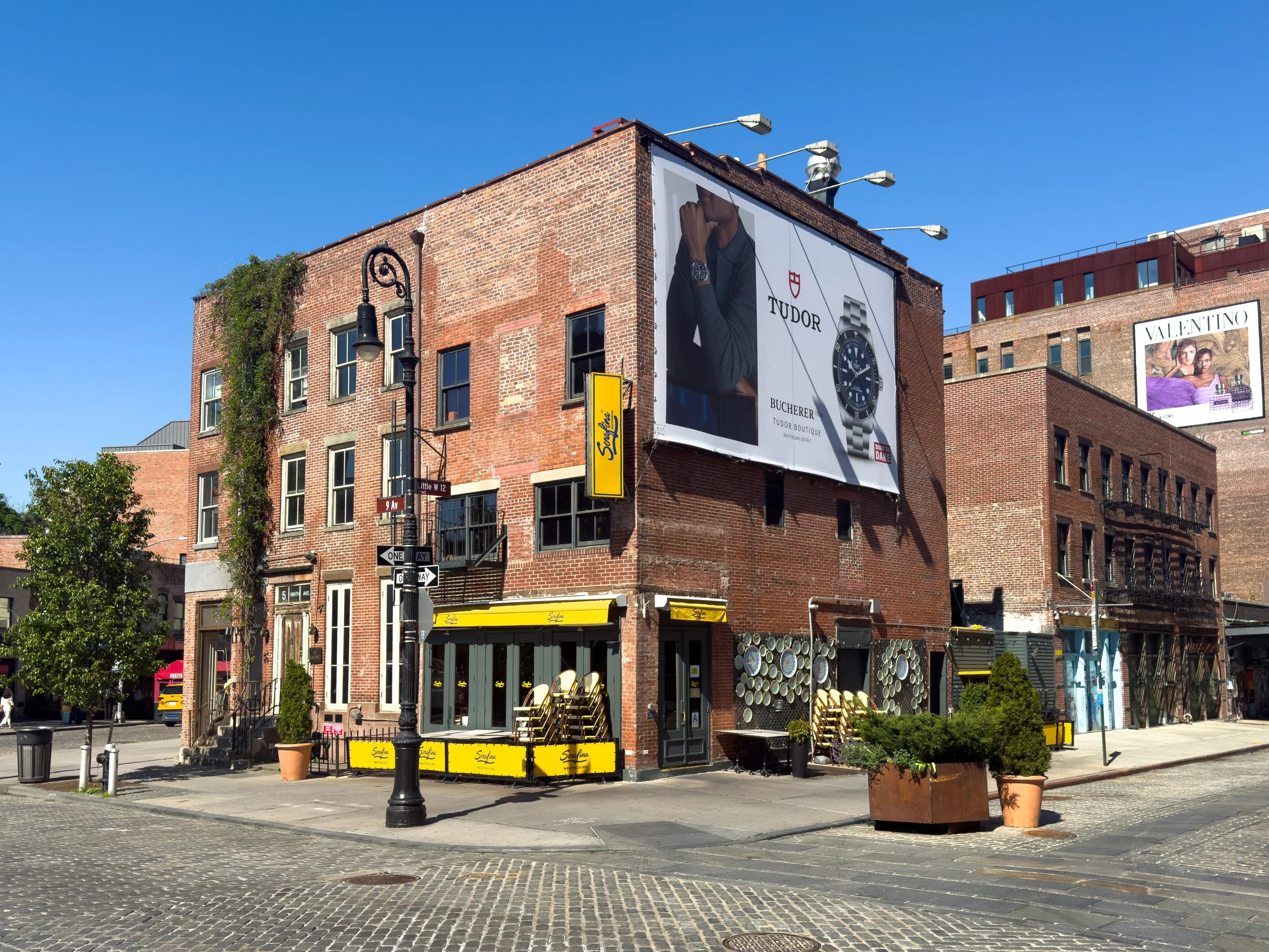 Historic brick building at Little West 12th Street and 9th Avenue Manhattan, NYC, reflecting the neighborhood’s cobblestone streetscape and mixed commercial architecture.