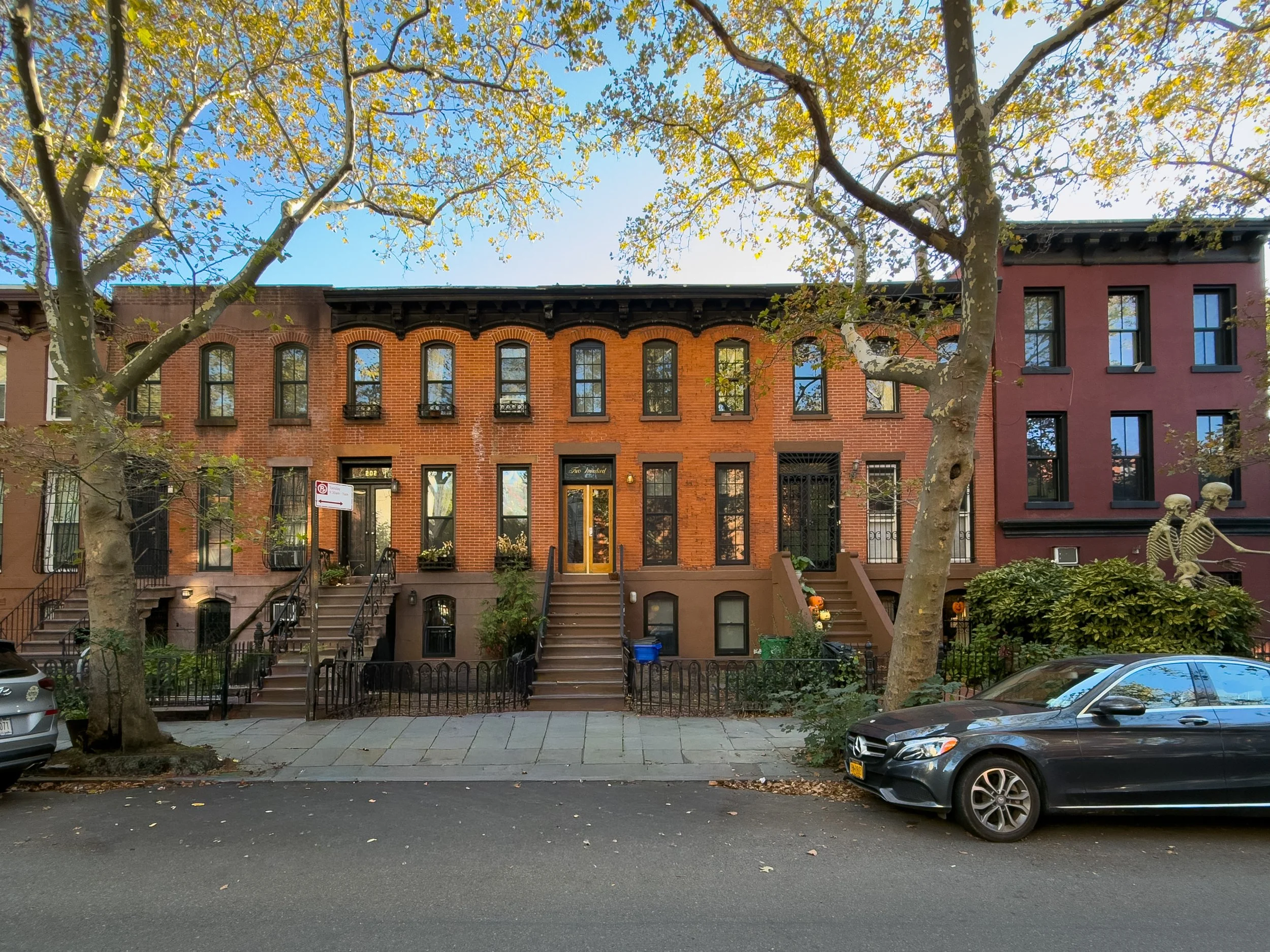 Tree-lined residential street with historic townhouses in Boerum Hill, Brooklyn, illustrating the neighborhood’s real estate character.
