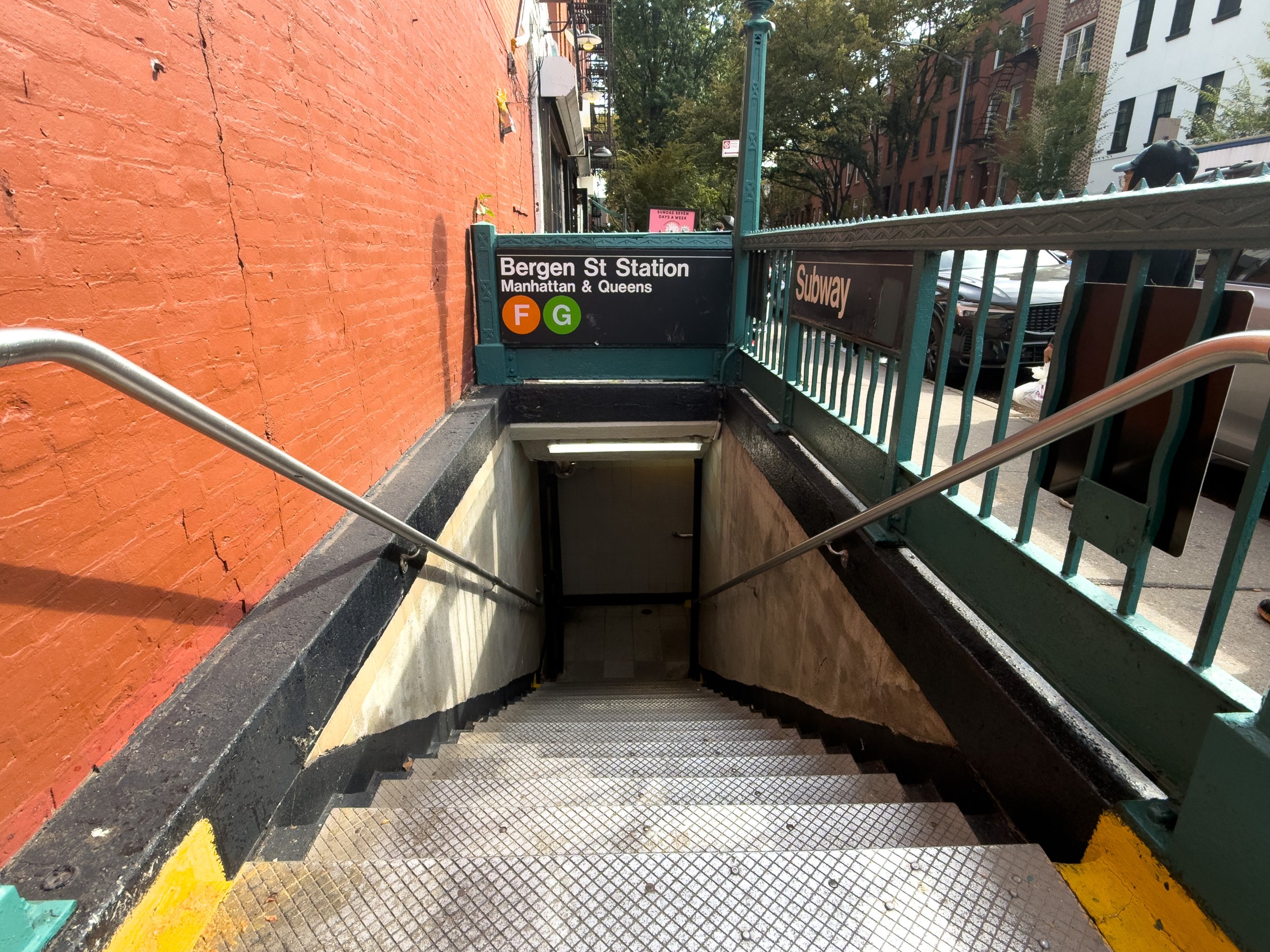 Entrance to the Bergen Street MTA subway station serving the F and G lines in Cobble Hill, Brooklyn, NYC, highlighting neighborhood transit access and connectivity.