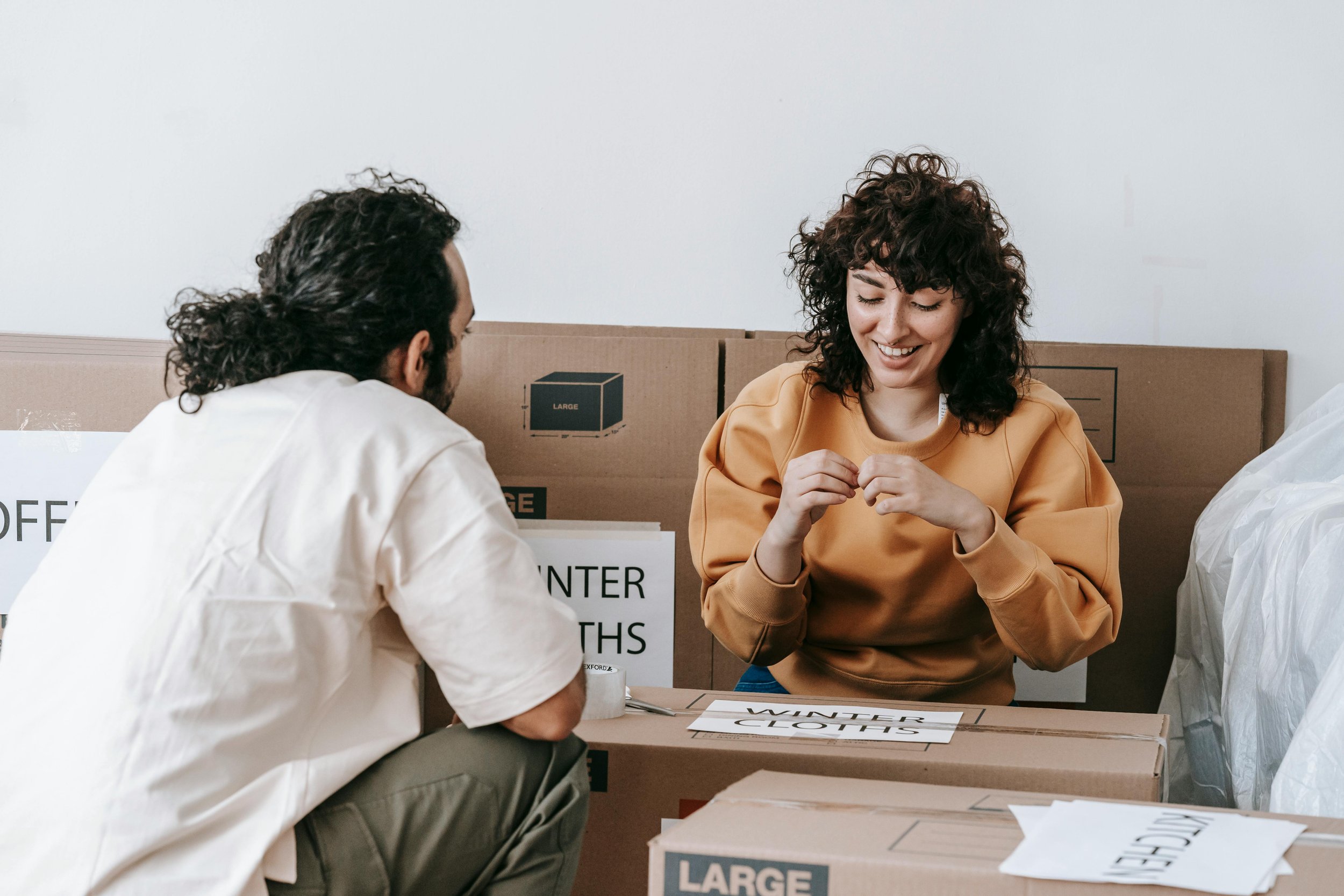 NYC homeowners preparing their apartment for rental, organizing belongings before listing the property