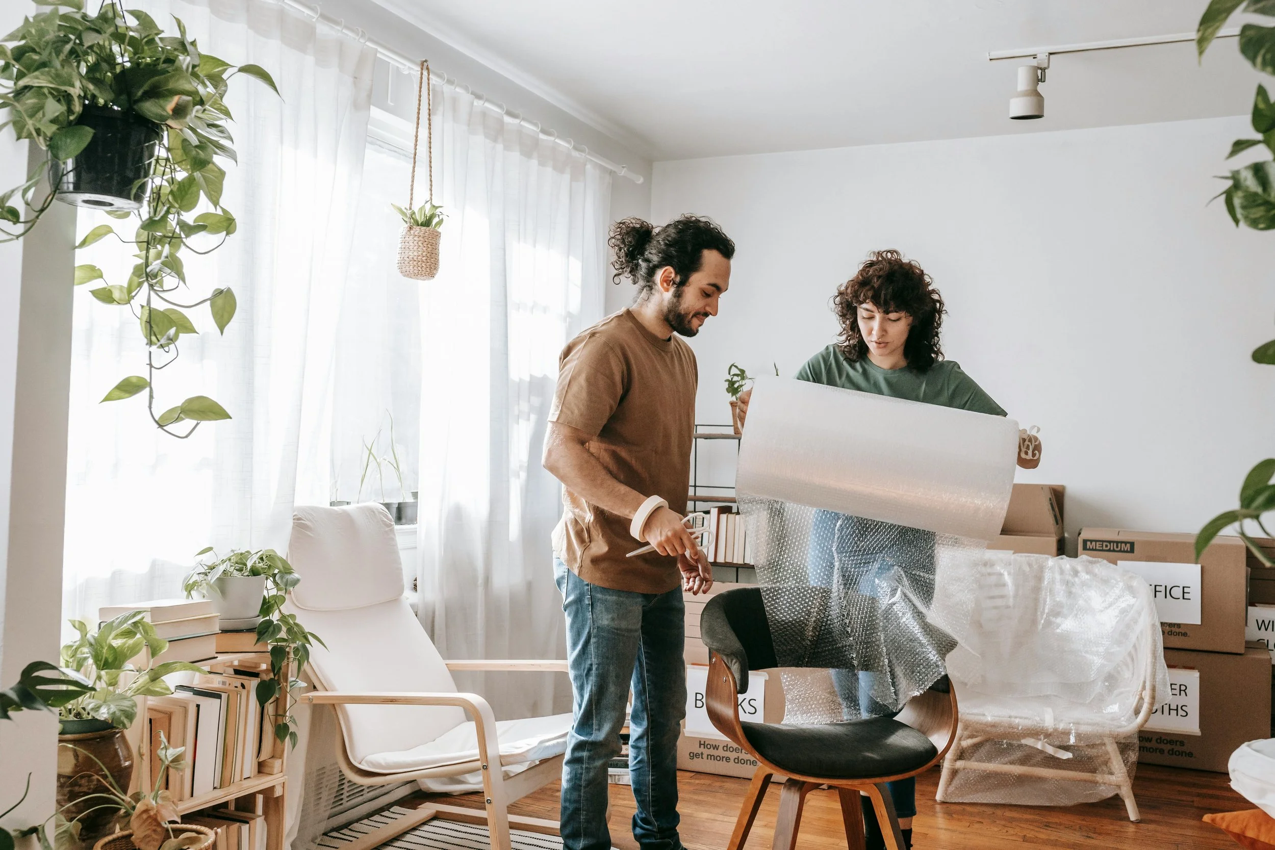 Couple unpacking boxes in a newly purchased NYC condominium