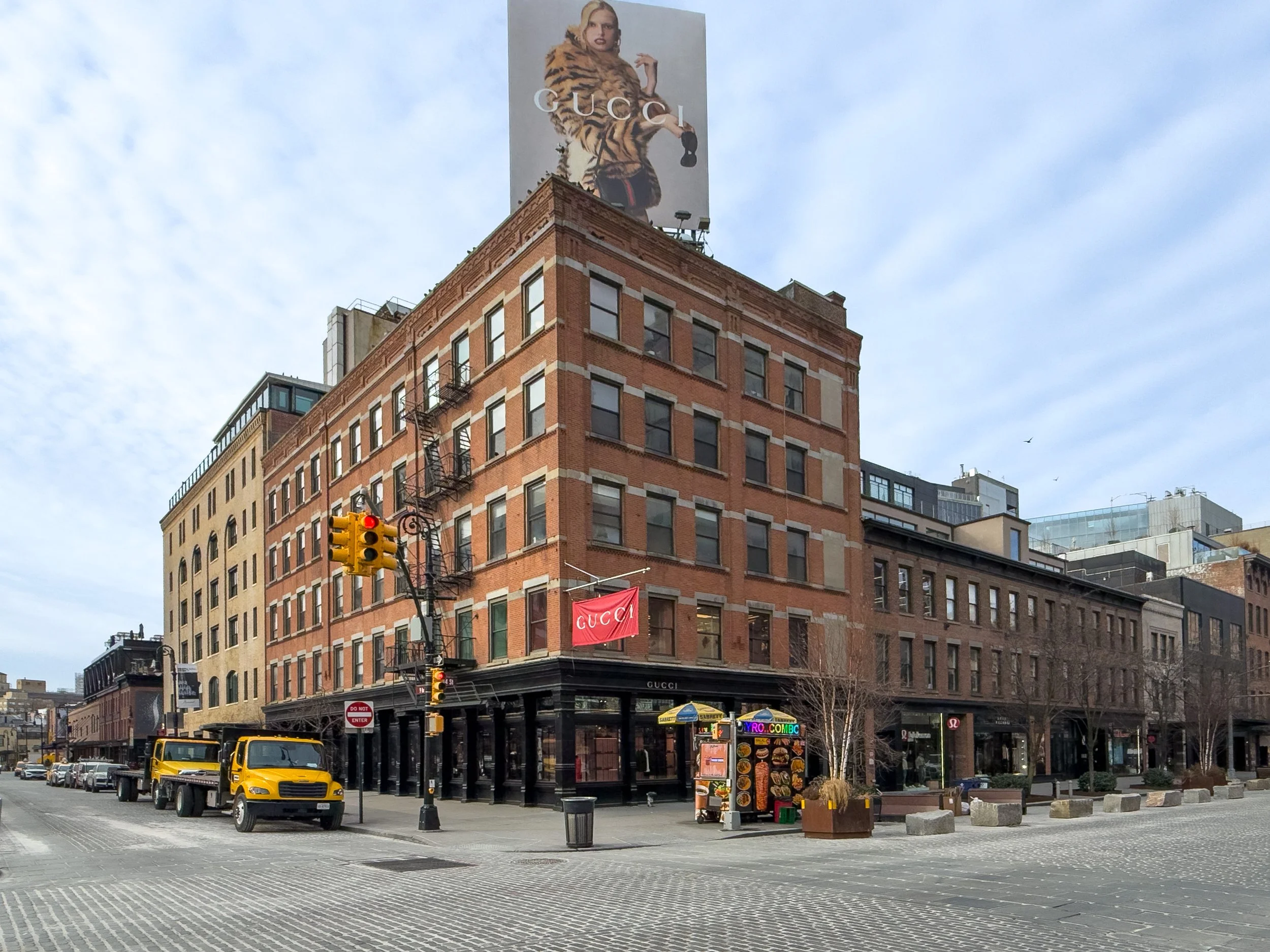 Streetscape at Chelsea Triangle near 14th Street and 9th Avenue in Chelsea, Manhattan, NYC, highlighting the neighborhood’s urban character and surrounding real estate.