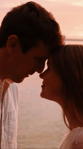 Engagement Video Reel of a couple in beach attire. Couple wearing white and khaki having a date on the beach. Philip Lee shoots wedding videos in Maryland with Ellie Photo Co.