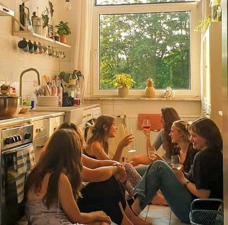 Group of friends drinking and laughing