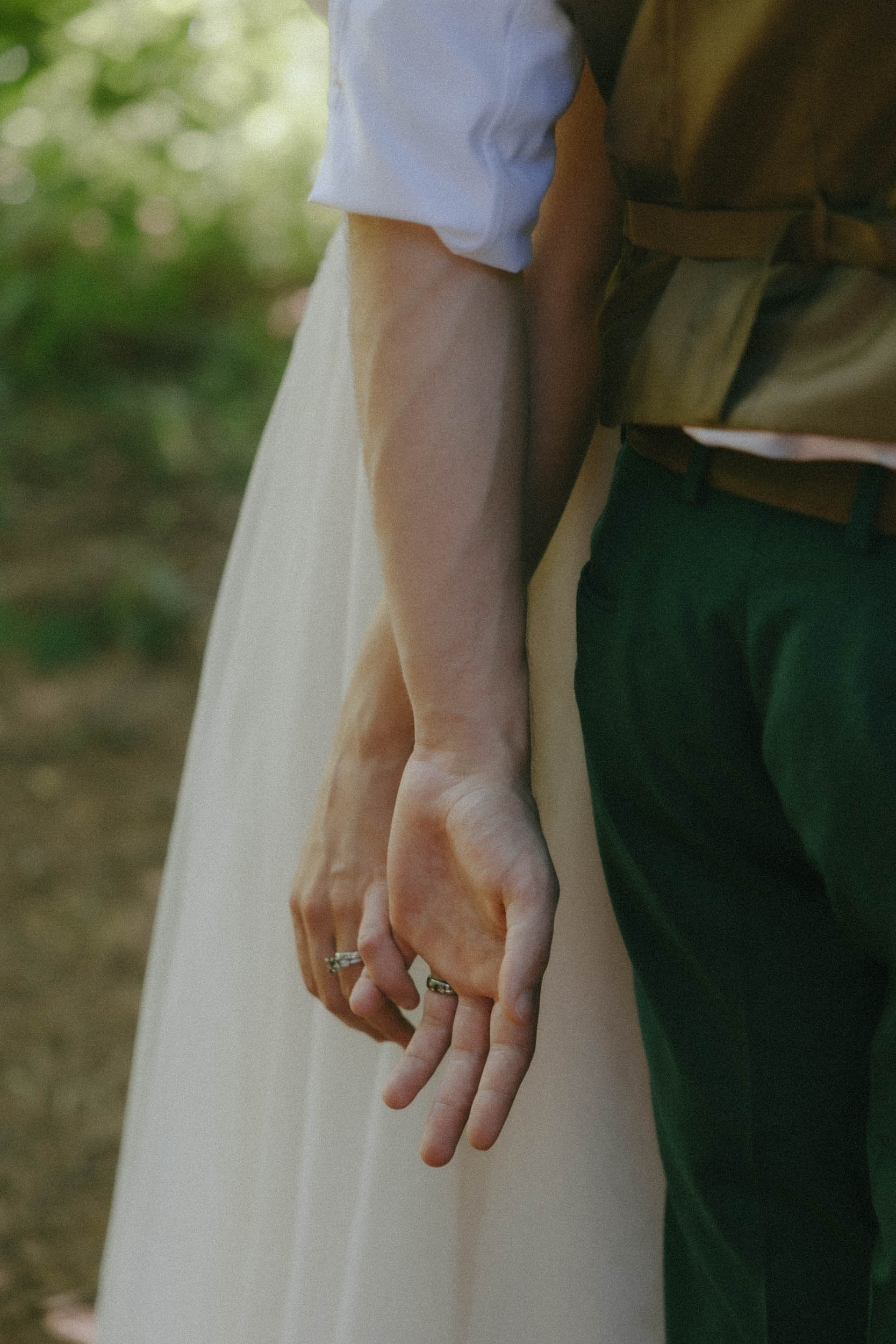 Close up shot of couple holding hands