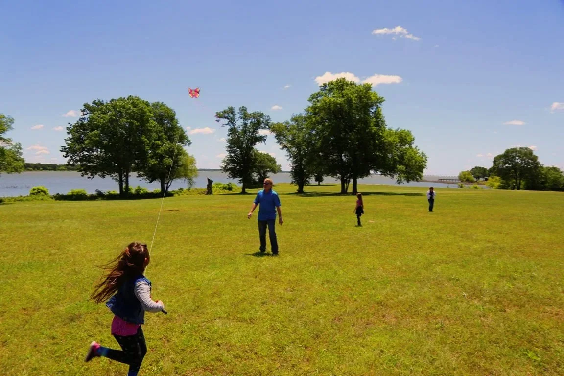 Children and adults enjoying the meadow on Peninsula Ranch 