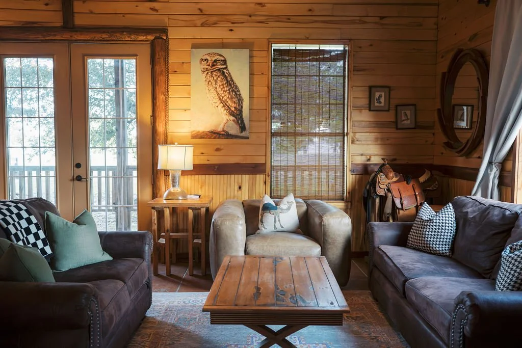 Living room with wooden walls at Peninsula Ranch in DFW 