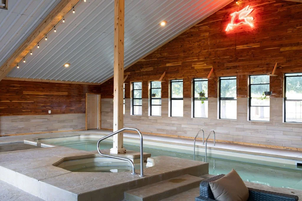 Guests enjoying the Temperature controlled pool at Peninsula Ranch in Dallas Texas
