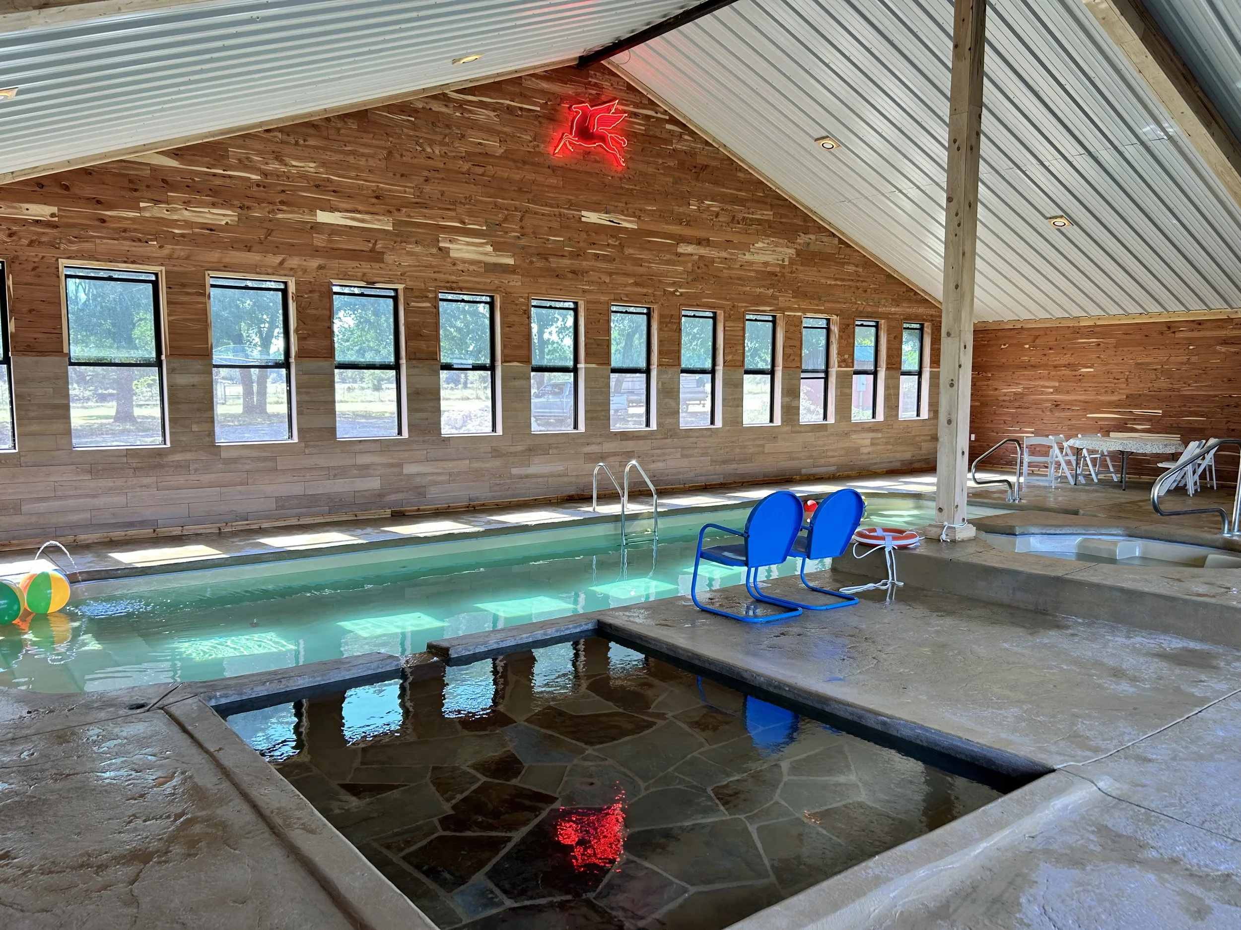 Guests enjoying the Temperature controlled pool at Peninsula Ranch in Dallas Texas