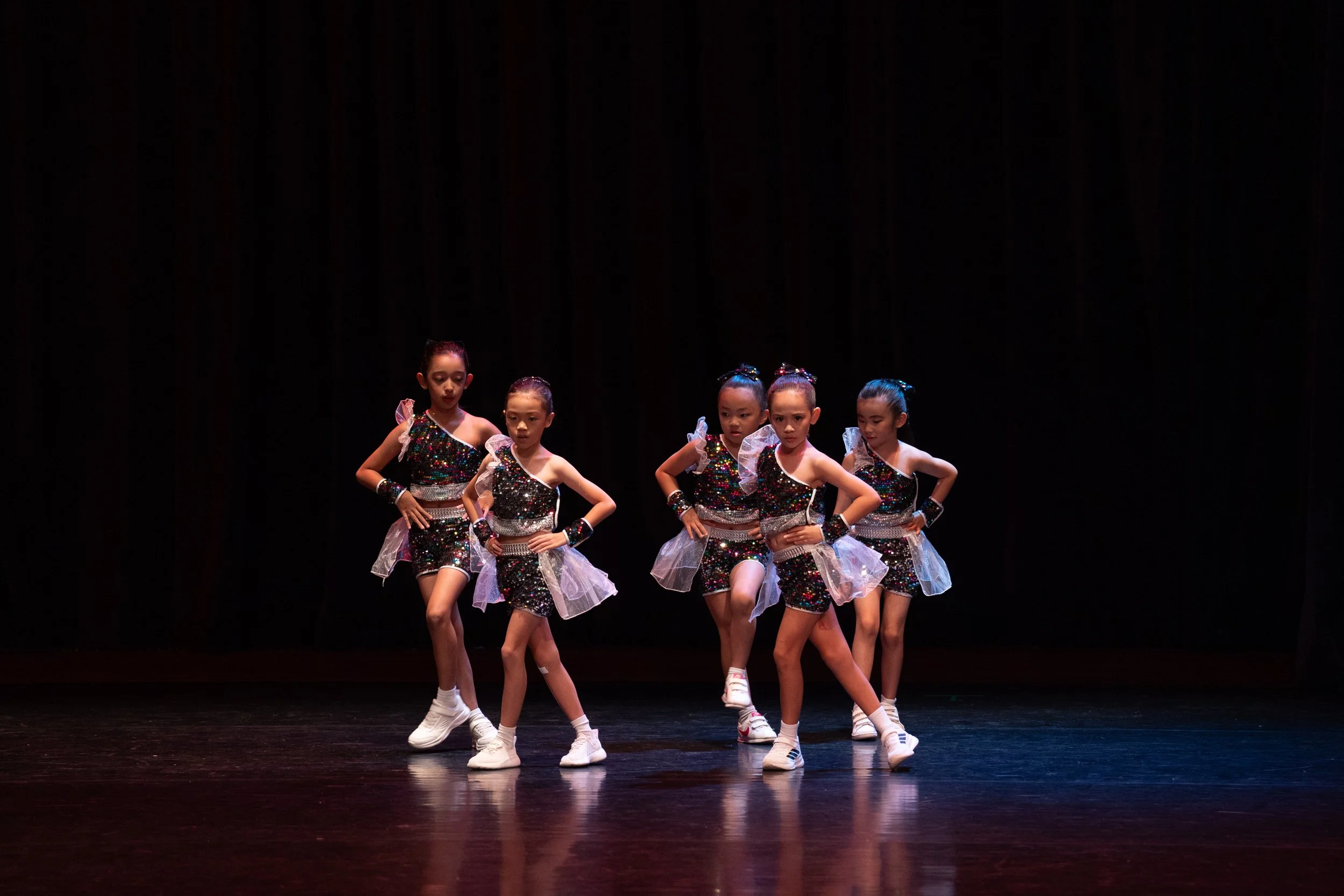 a group of dancers performing jazz