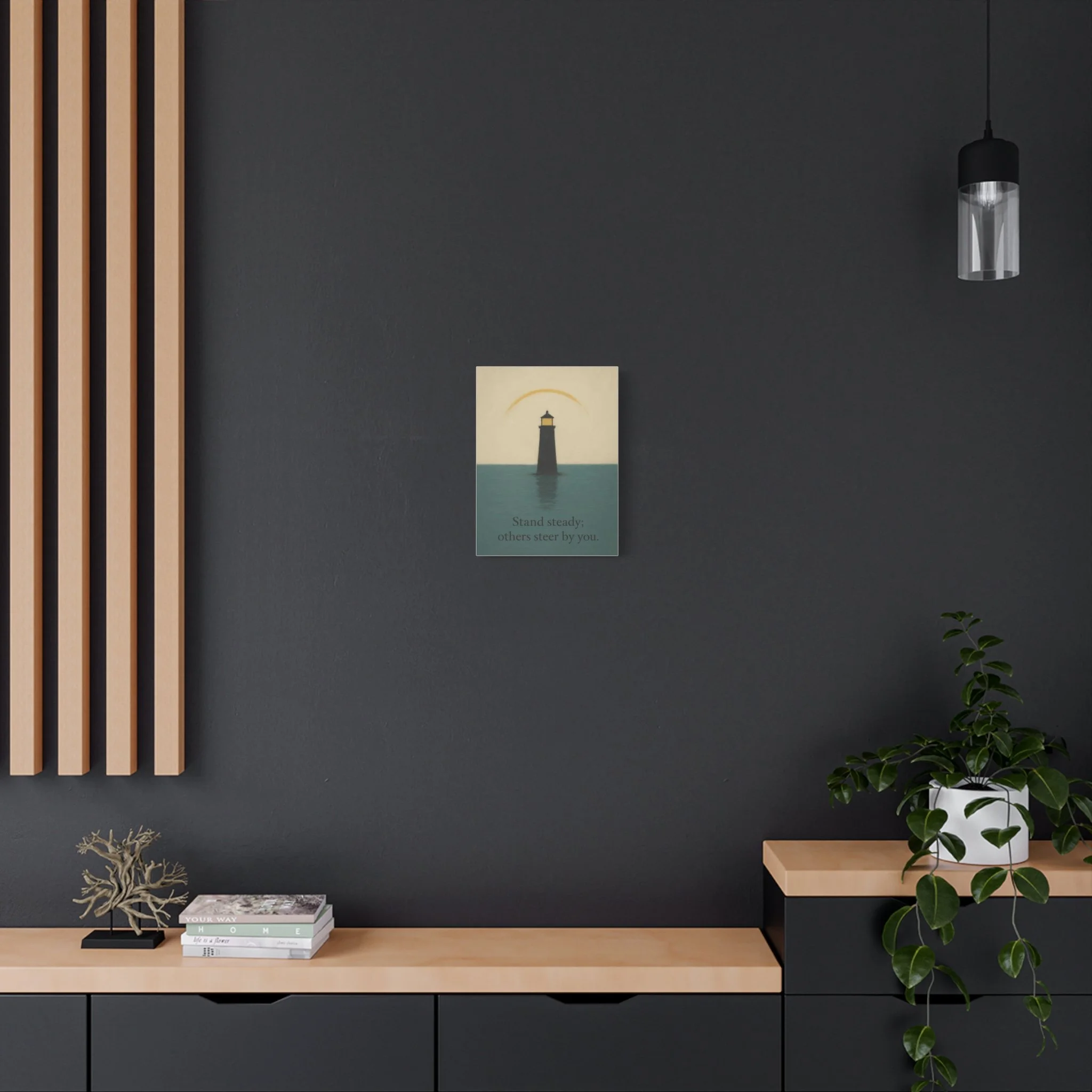 Room mockup of lighthouse canvas on a dark wall above a bench, with plant and pendant light.