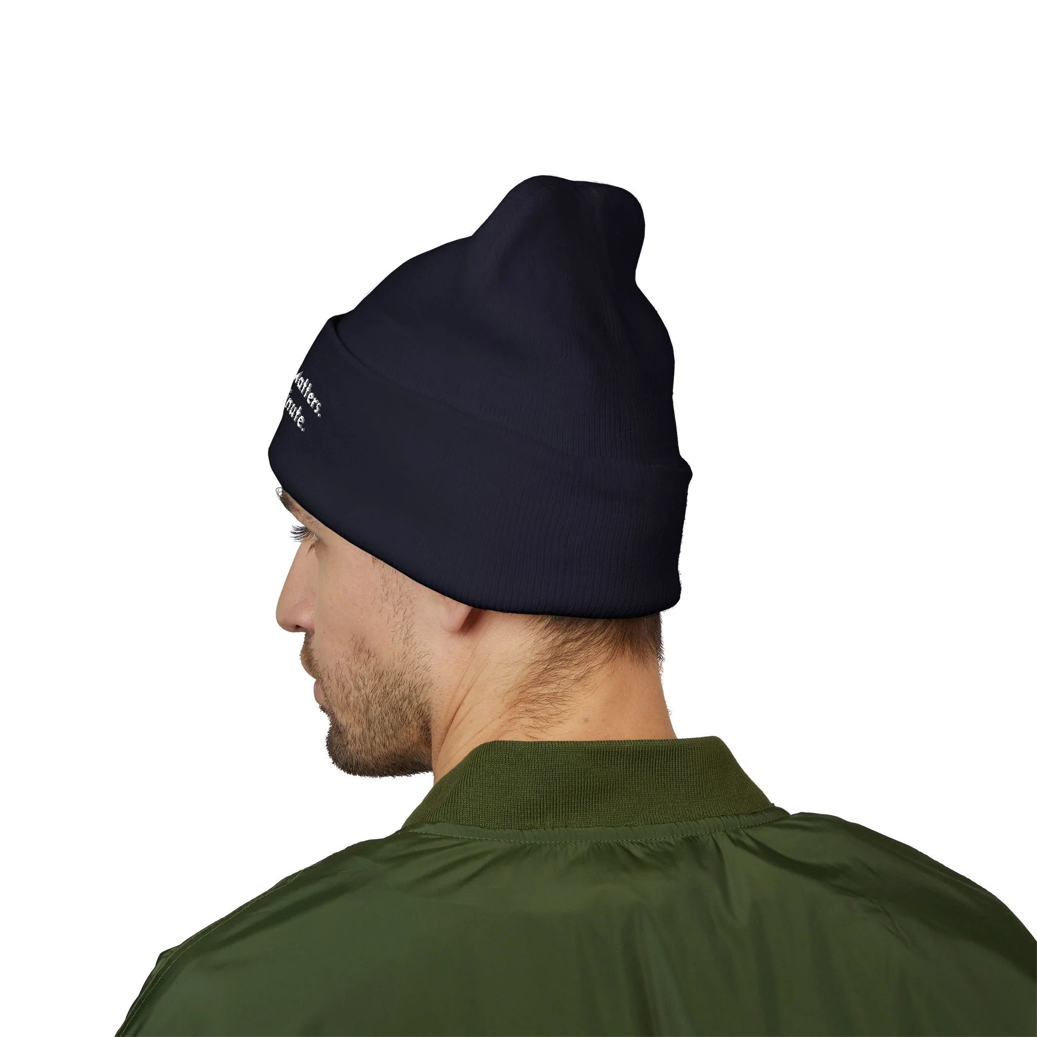 Lifestyle side view of person wearing cuffed beanie.