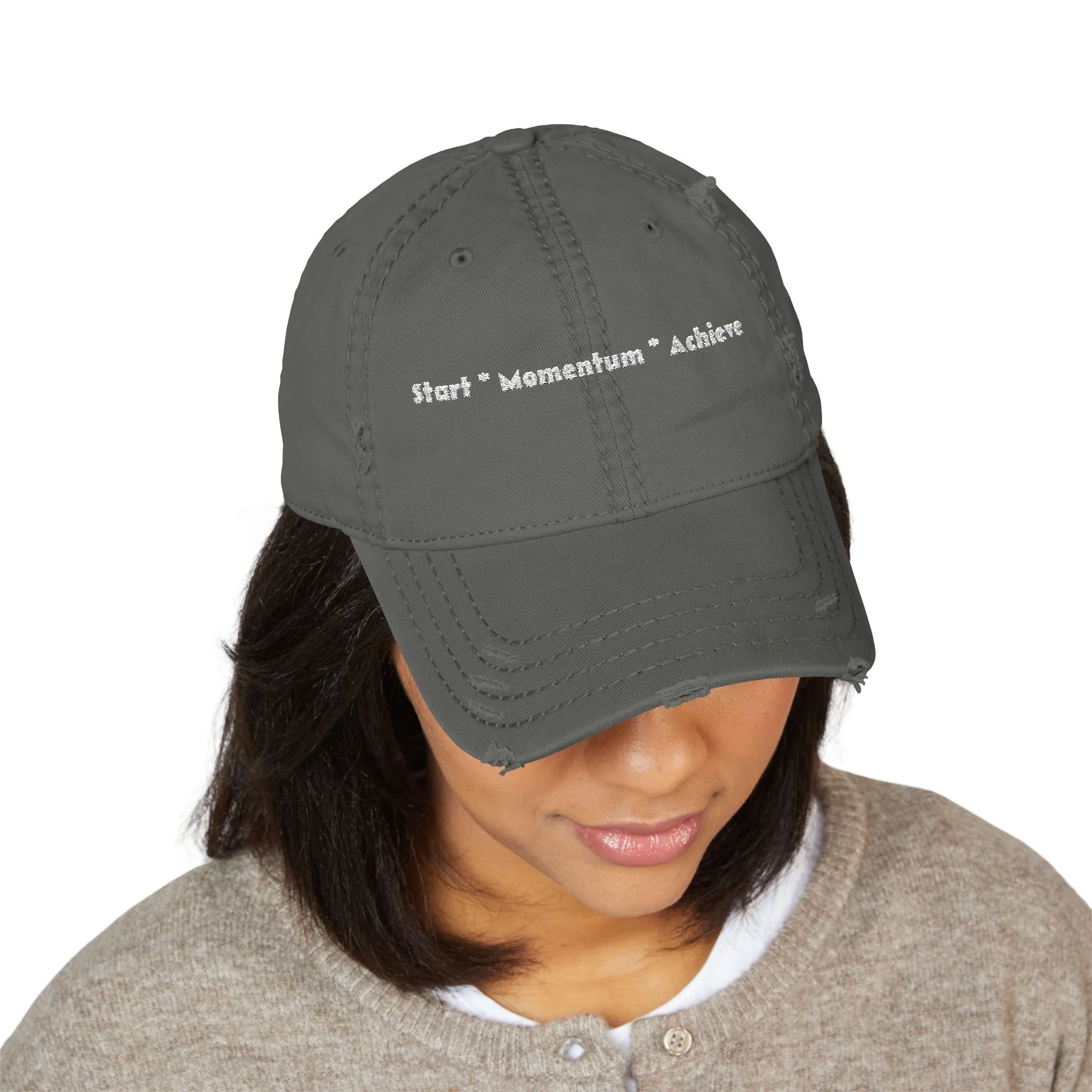 Lifestyle front view of person wearing 'Start Momentum Achieve' hat.