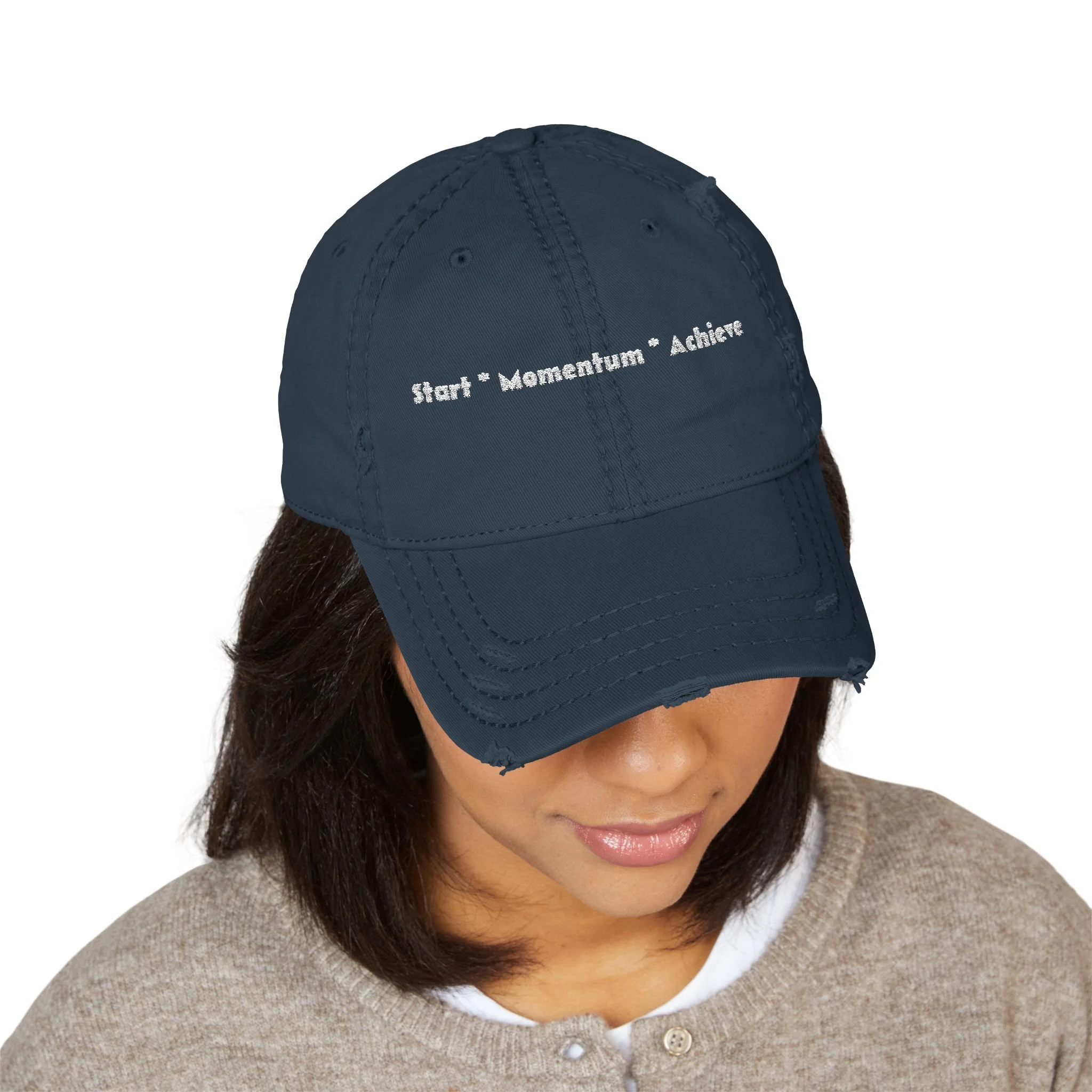 Lifestyle front view of person wearing 'Start Momentum Achieve' hat.