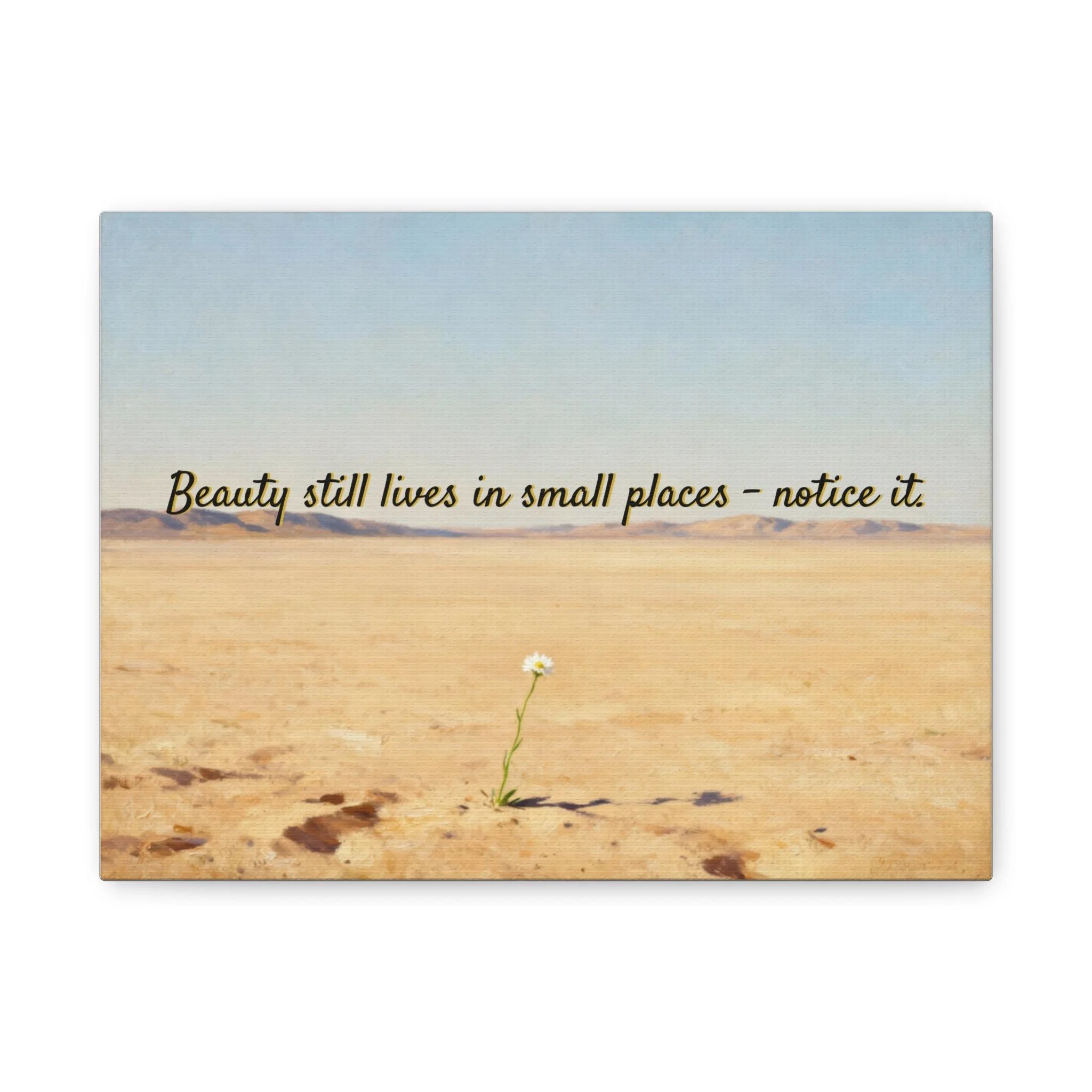 Front view of inspirational desert canvas print with a single bloom and 'Beauty still lives in small places' message.