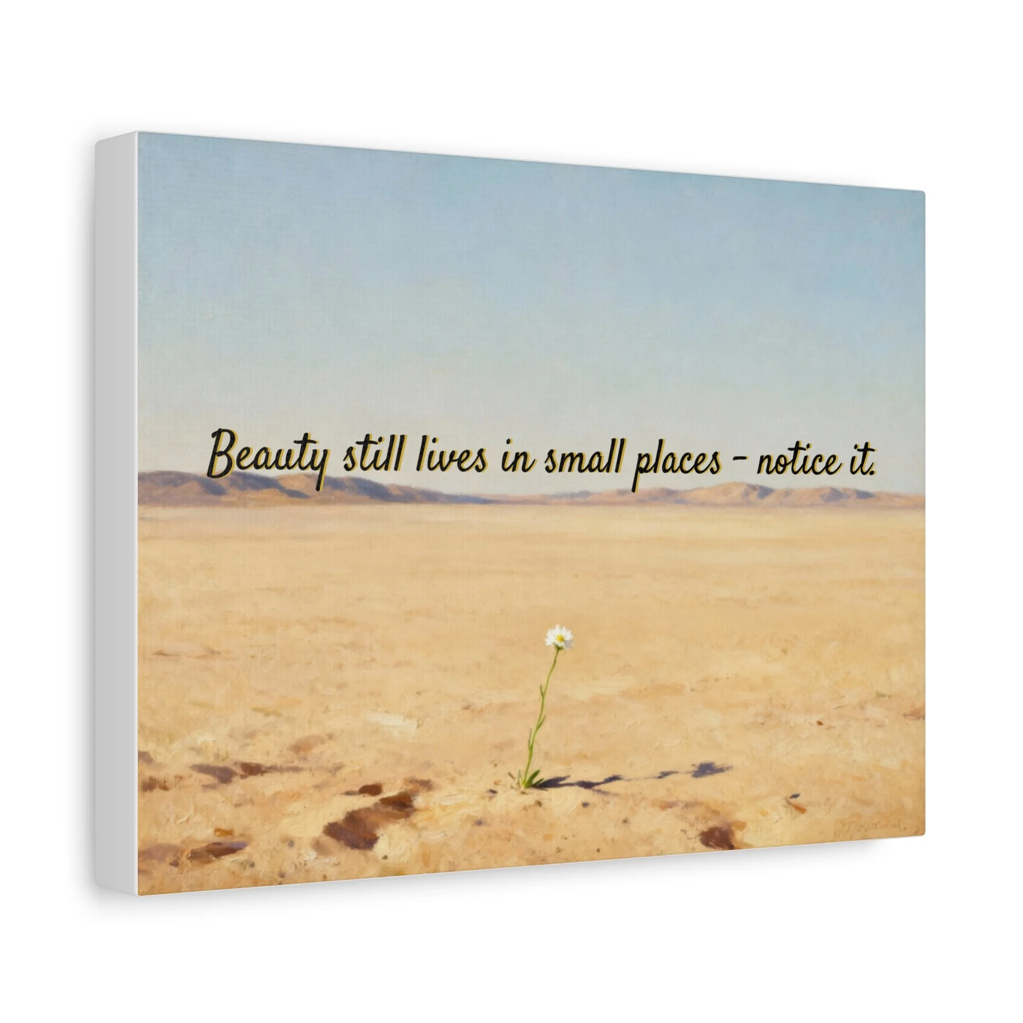 Angled wall mockup of desert canvas art with single bloom.