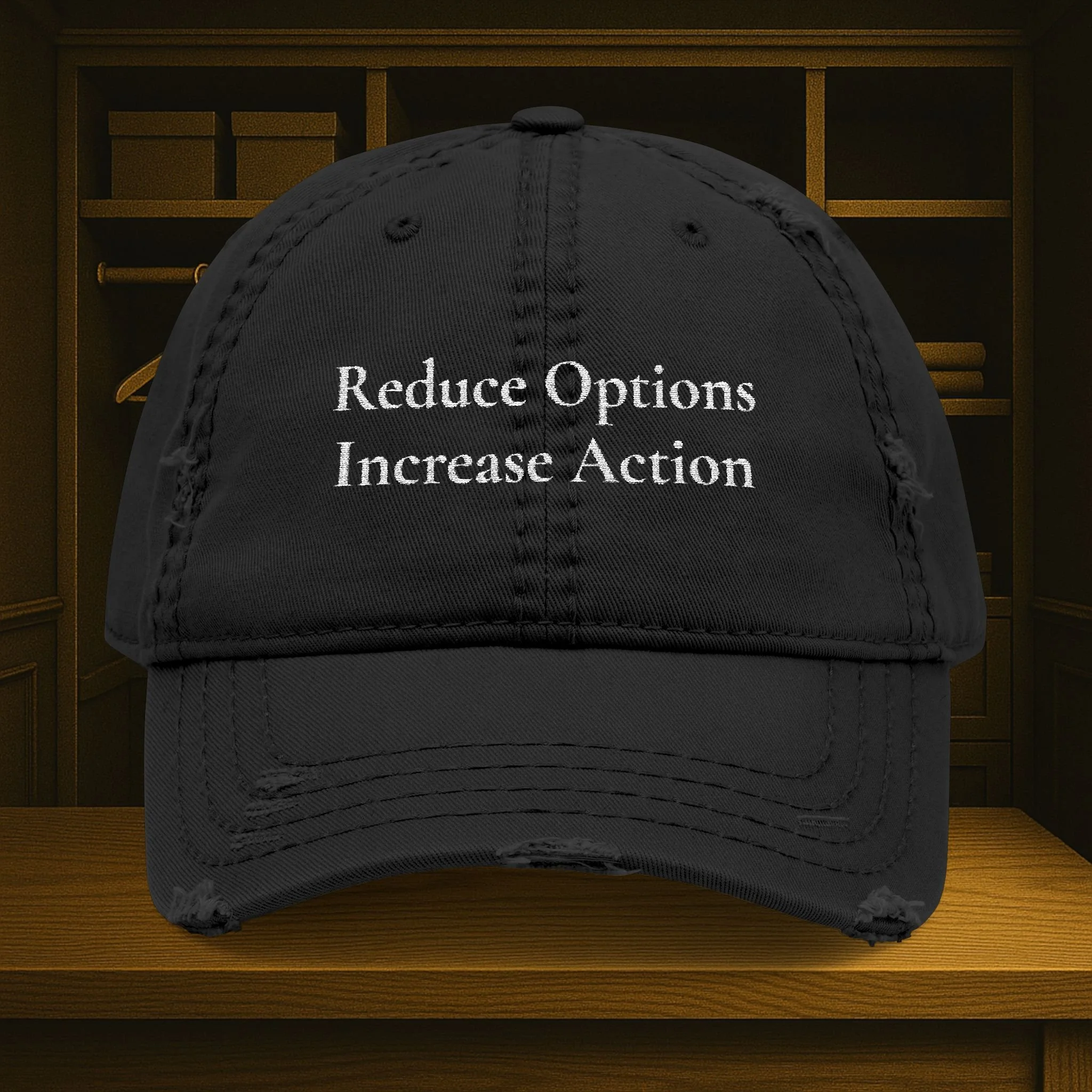 Front view of distressed dad hat with embroidered 'Reduce Options Increase Action' message.