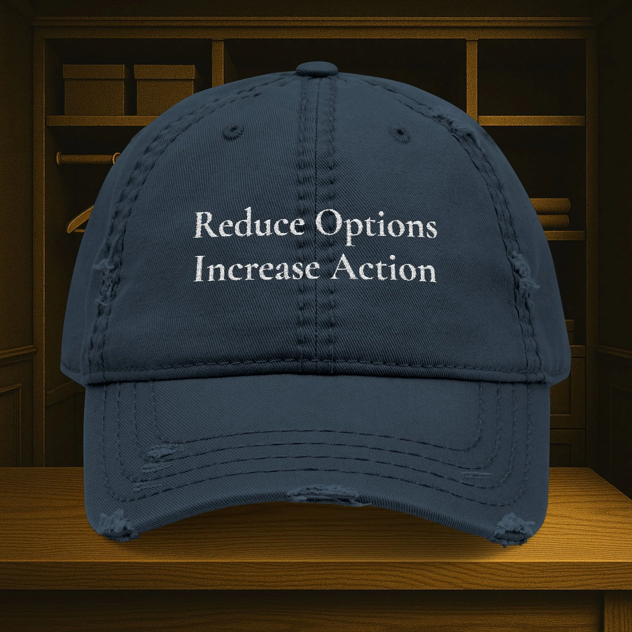 Front view of distressed dad hat with embroidered 'Reduce Options Increase Action' message.
