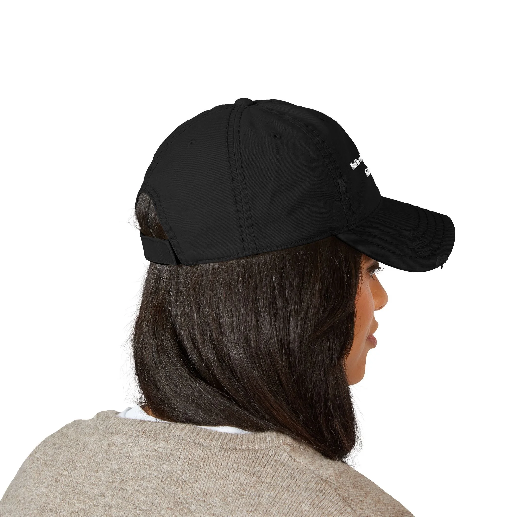 Lifestyle side view of person wearing distressed dad hat with embroidered “Start the Work. Keep Moving. Finish Strong.” message