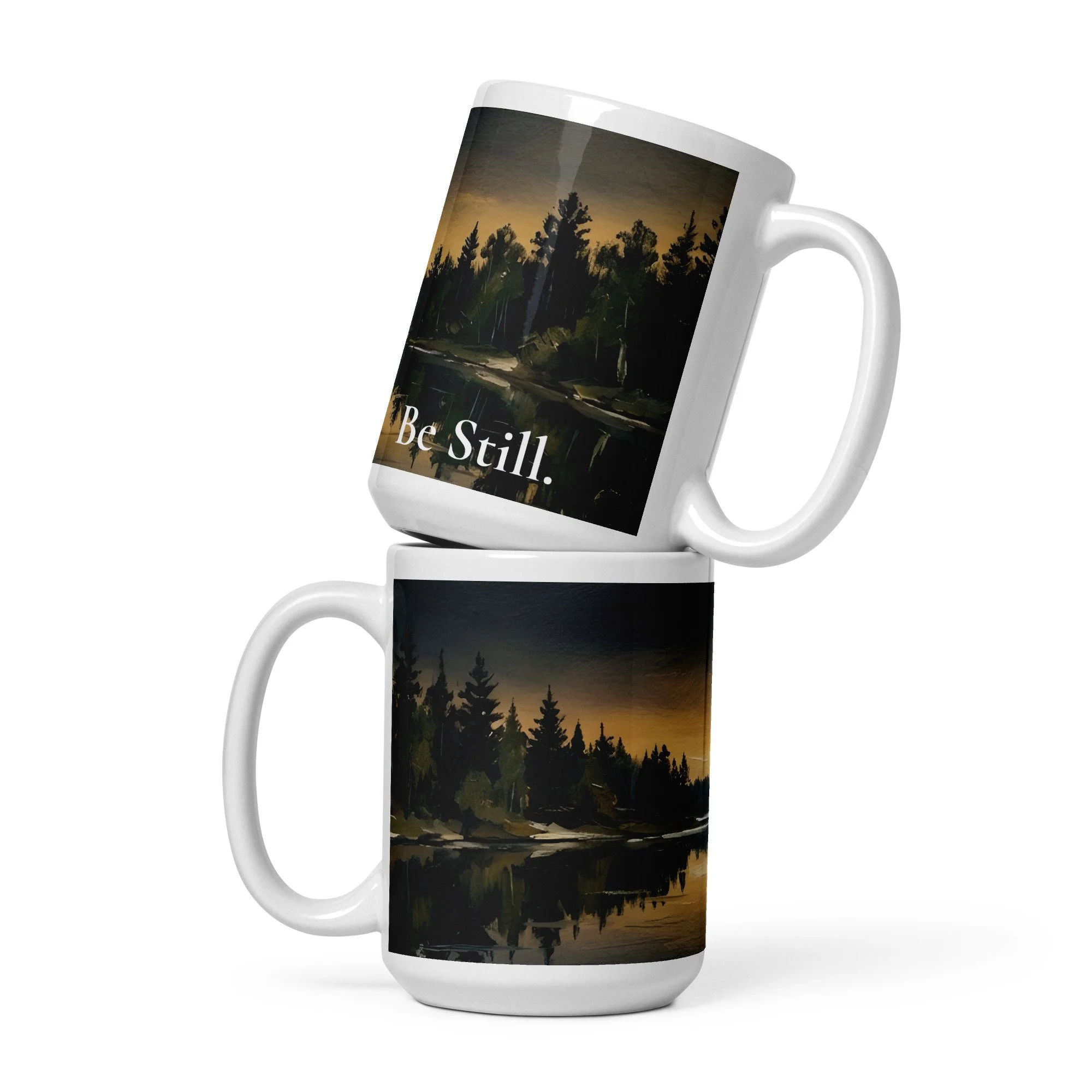 Close-up of the "Be Still" design printed on a white 15 oz. ceramic mug on top of another.