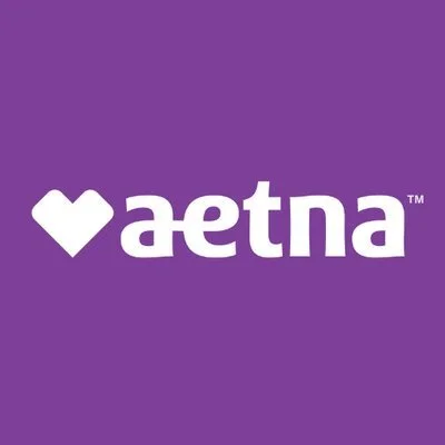 A purple background with the white Aetna logo and a heart symbol.