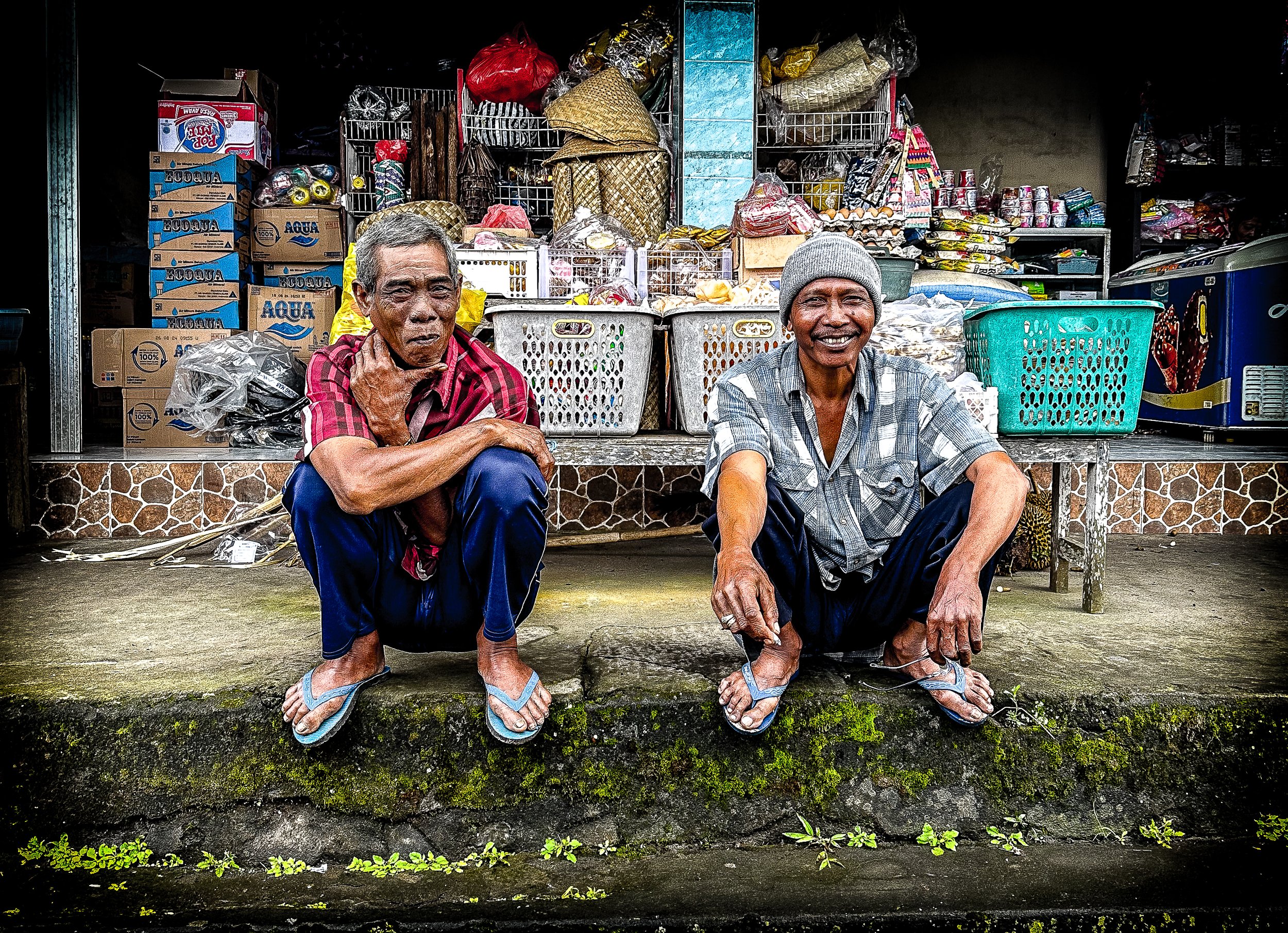 Two men sat outside their small shop, resting after another long day. Life had never been easy for them, but they had grown used to the struggles. They were no strangers to hard work, having spent their entire lives scraping by in a country where pov