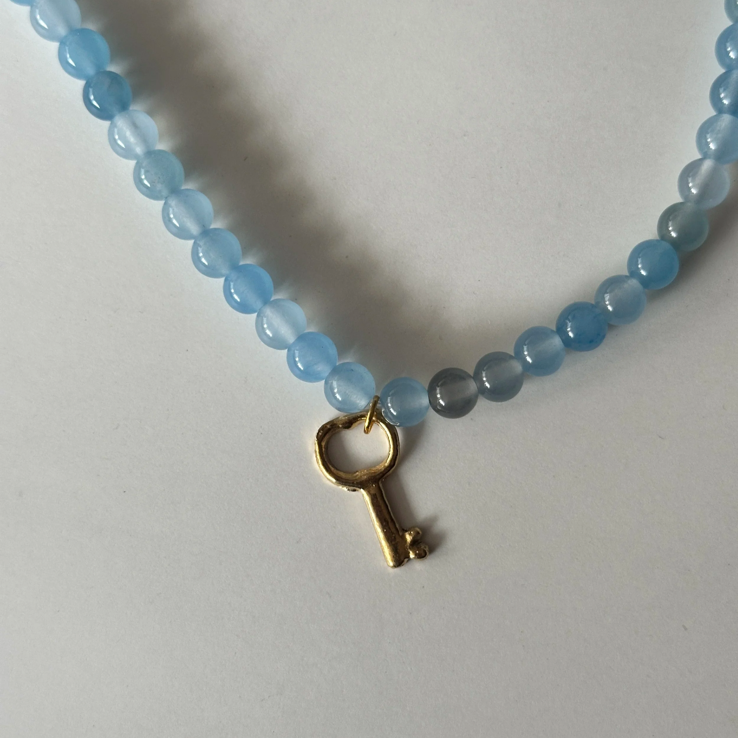 Collar piedra y milagro DORADO con Ágata azul y Llave (copia)